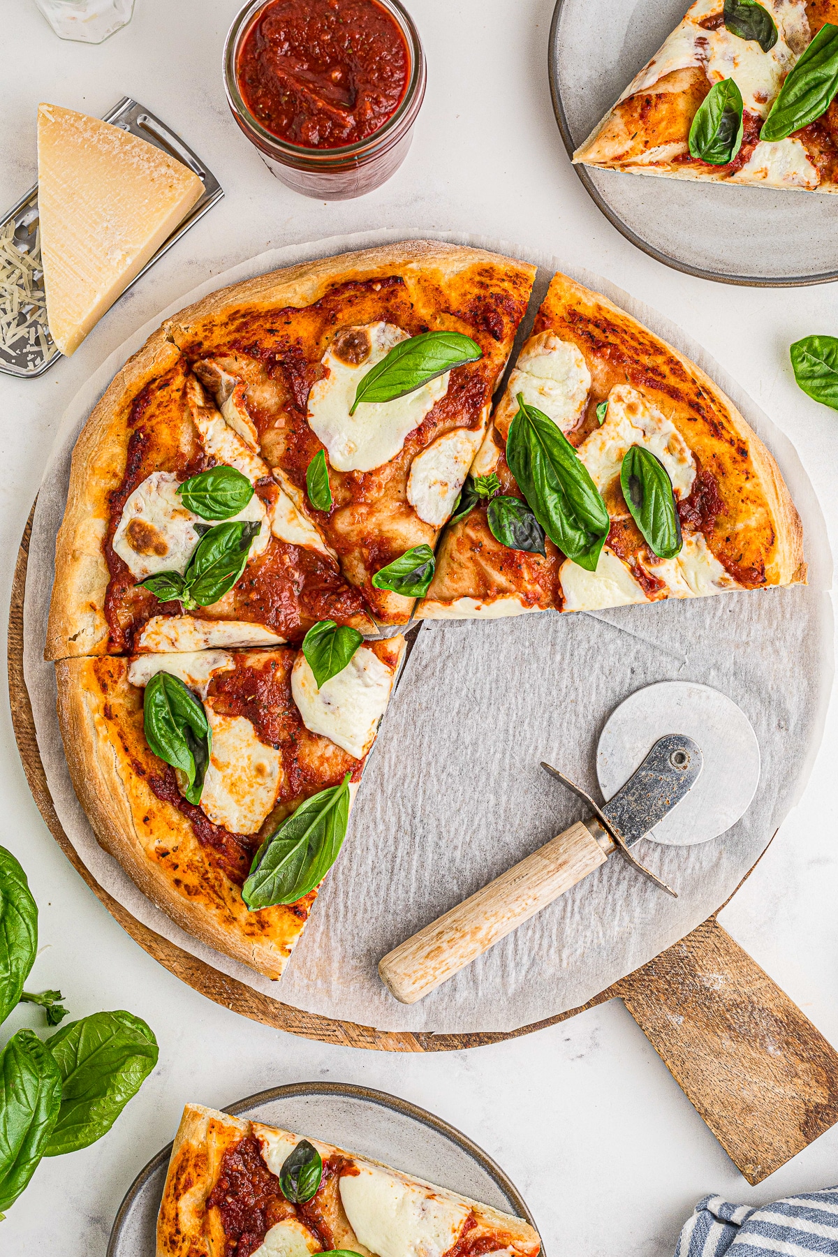 sliced Margherita Pizza on pizza peel