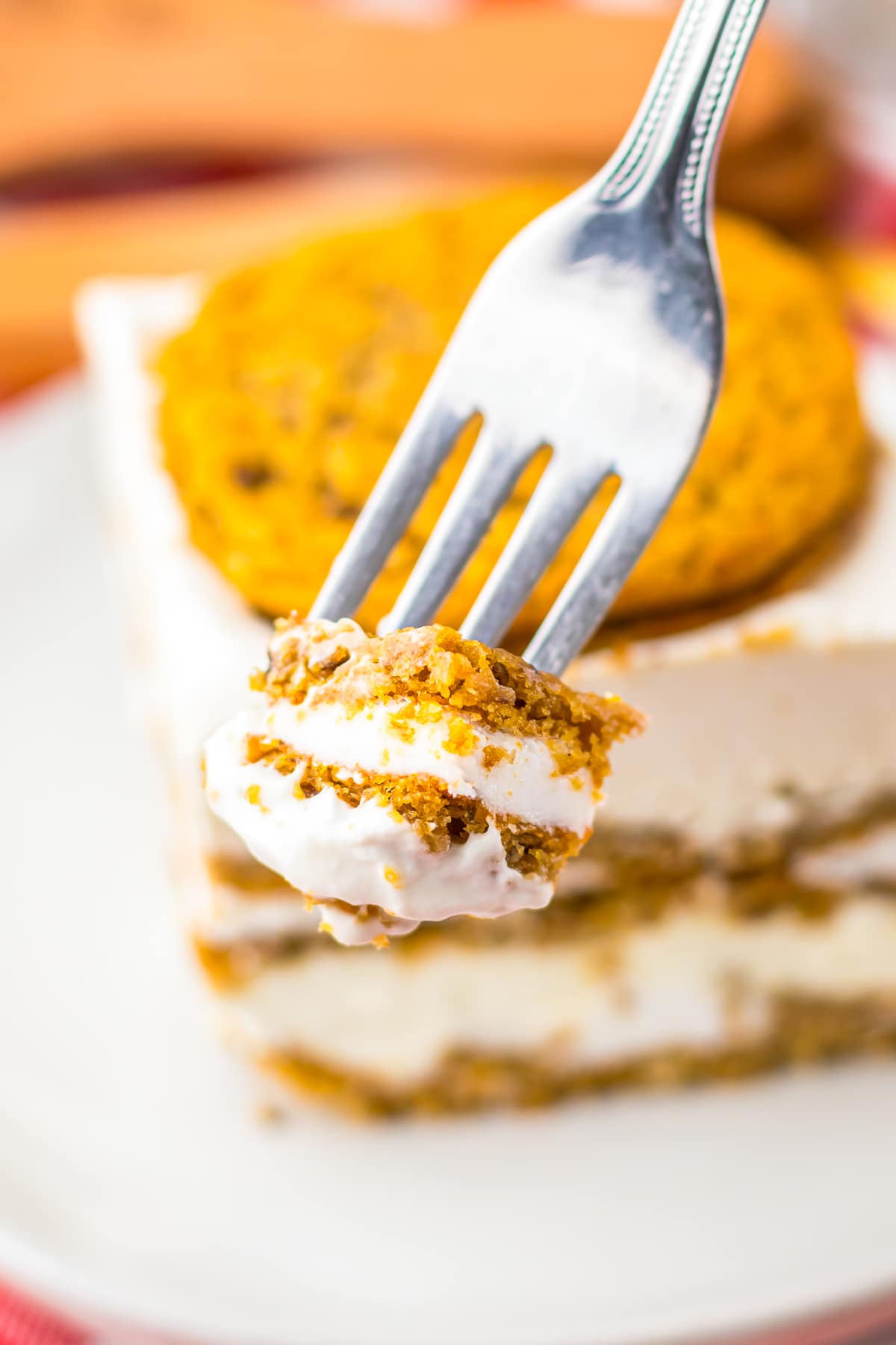 a fork holding up a bite of Ice Cream Bars in air