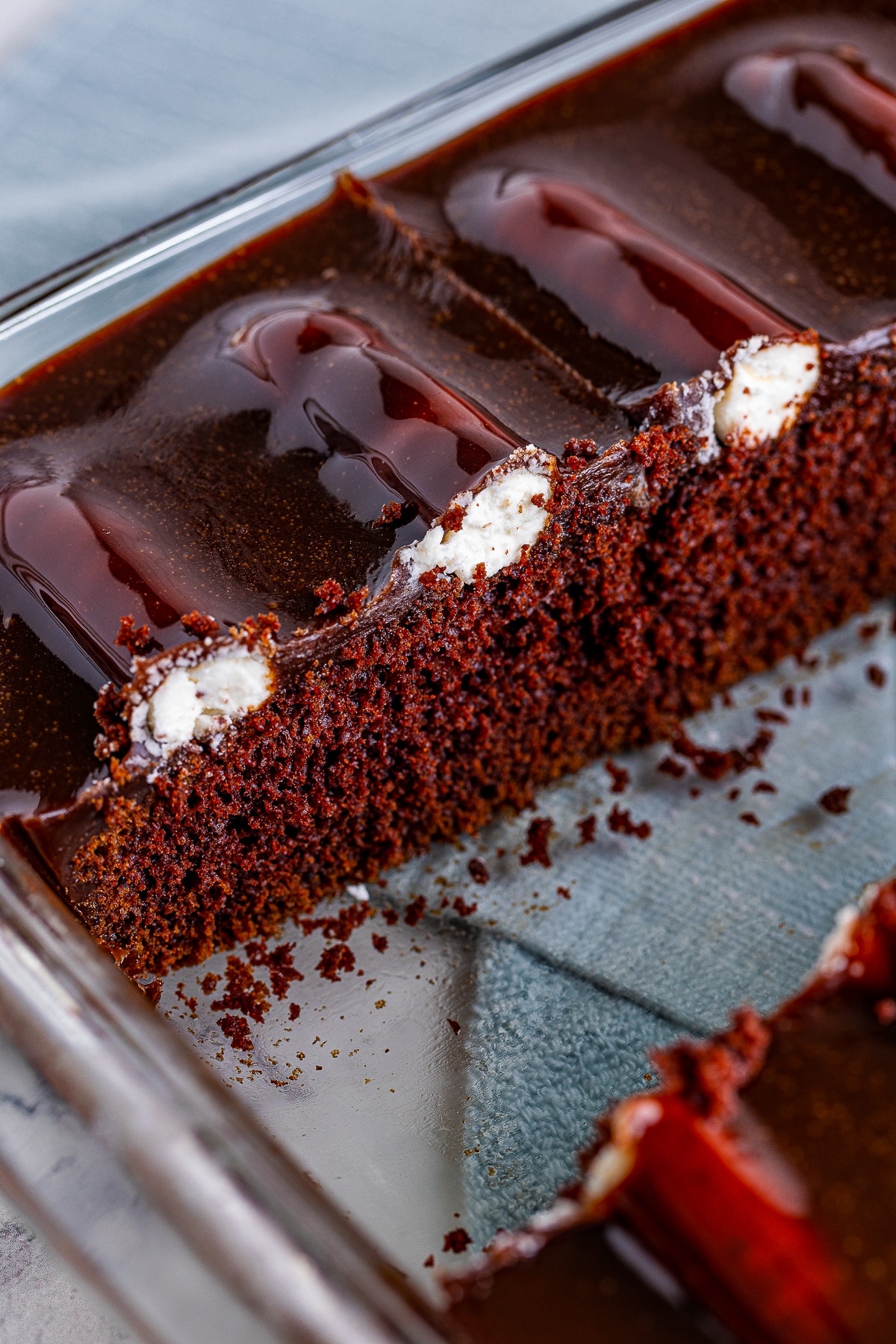 slices of Bumpy Cake taken out of baking dish
