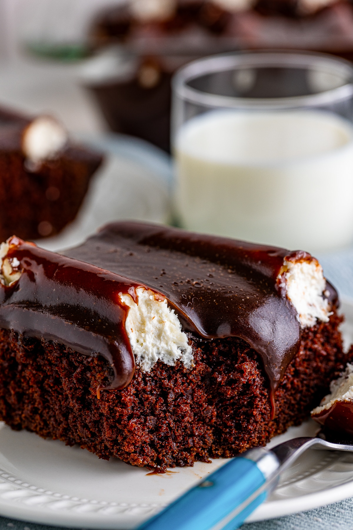 a slice of Bumpy Cake on a plate with a bite taken out