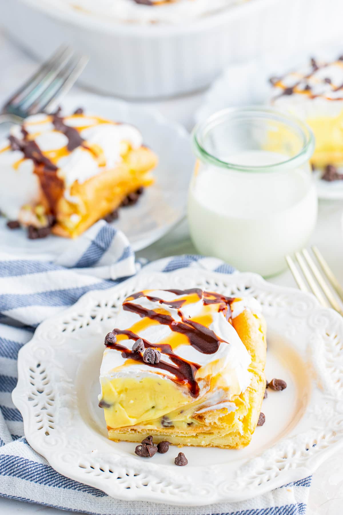 slices of Cream Puff Cake on white plates