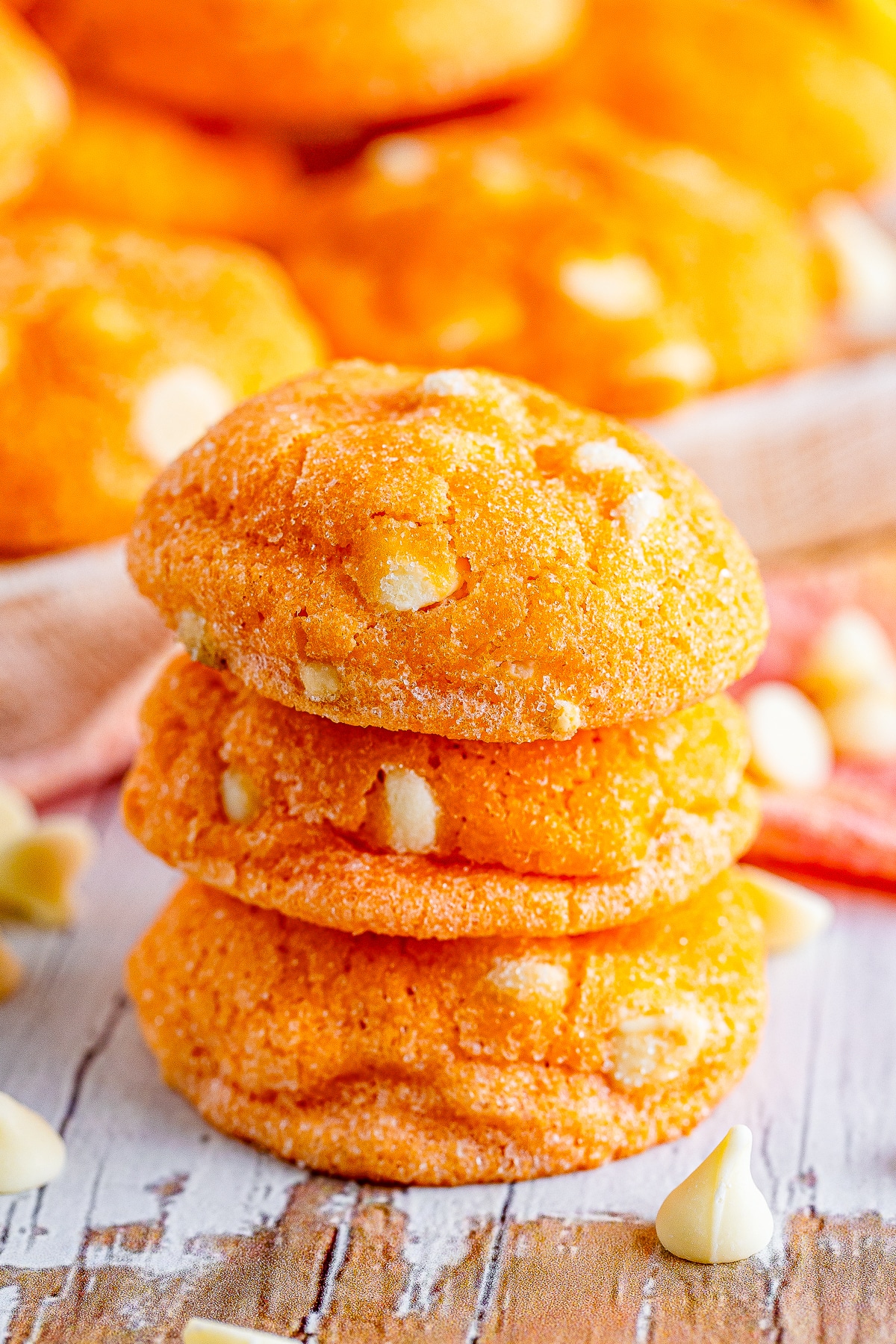 three Orange Creamsicle Cookies stacked on top of each other