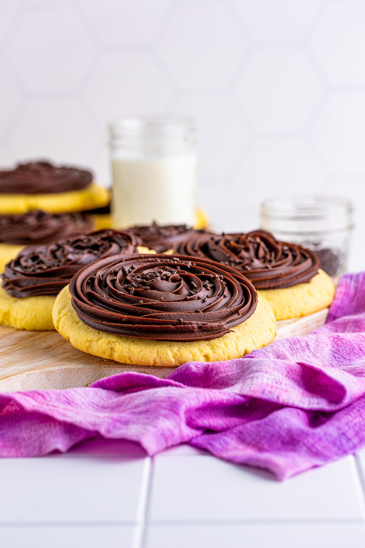 farther away image of Chocolate Cupcake Cookies on wooden board