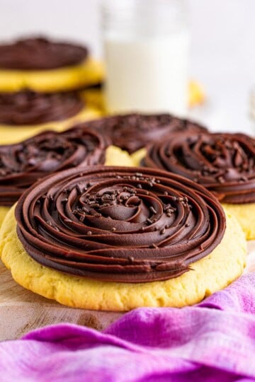 Crumbl Chocolate Cupcake Cookies with a tall piped chocolate ganache rosette and sprinkles.