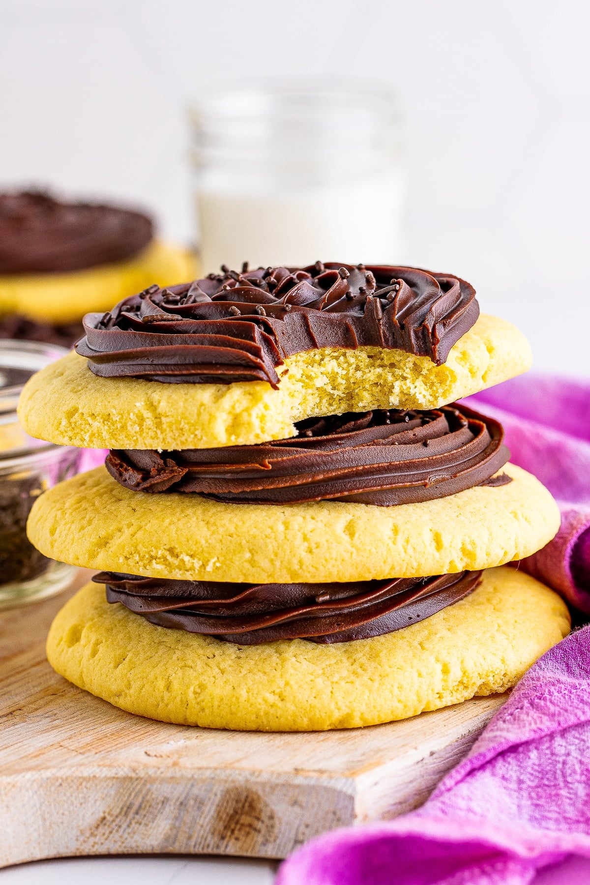 3 Chocolate Cupcake Cookies stacked on top of each other, the one on top has a bite taken out