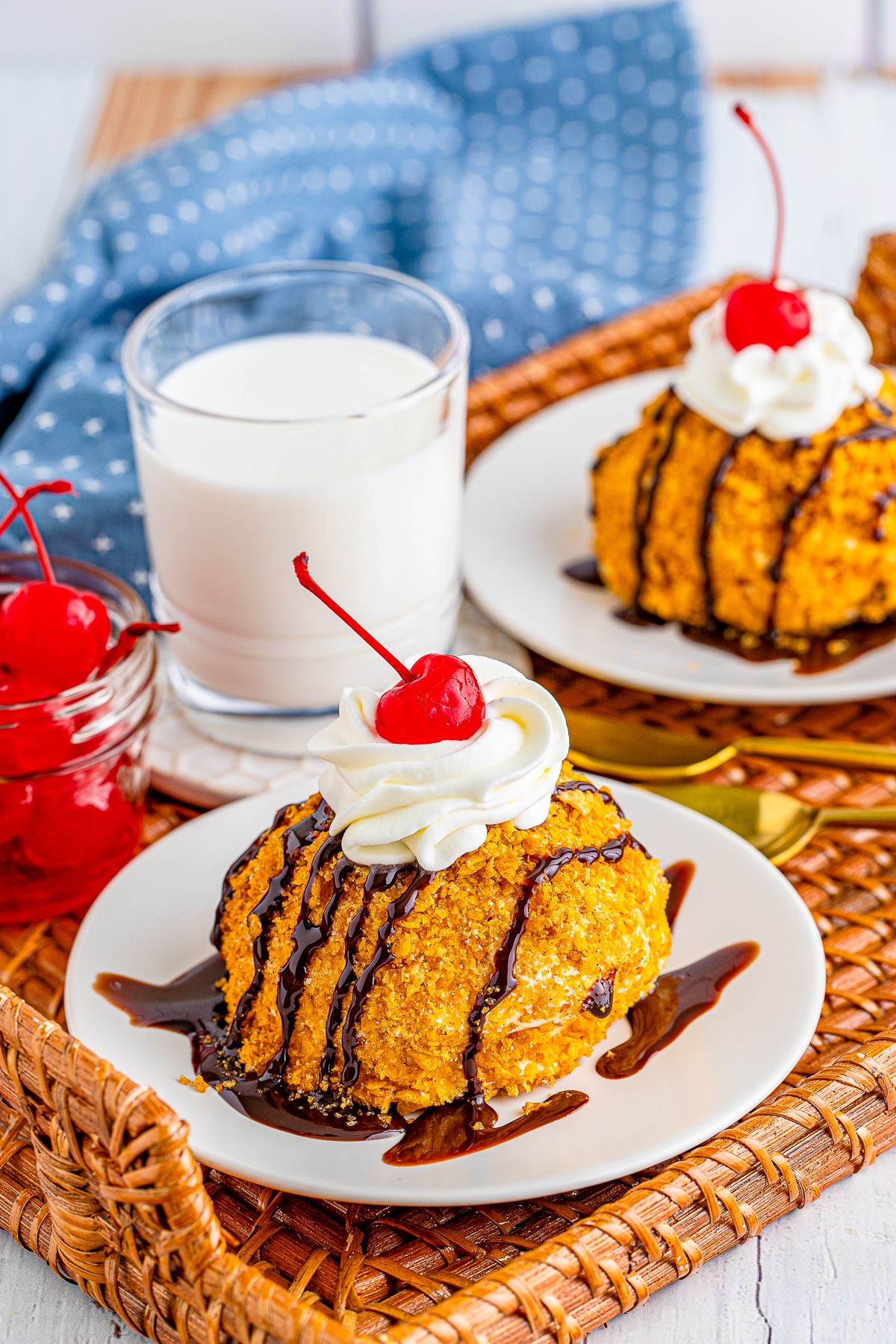 farther away image of fried ice cream served on plates with garnishes