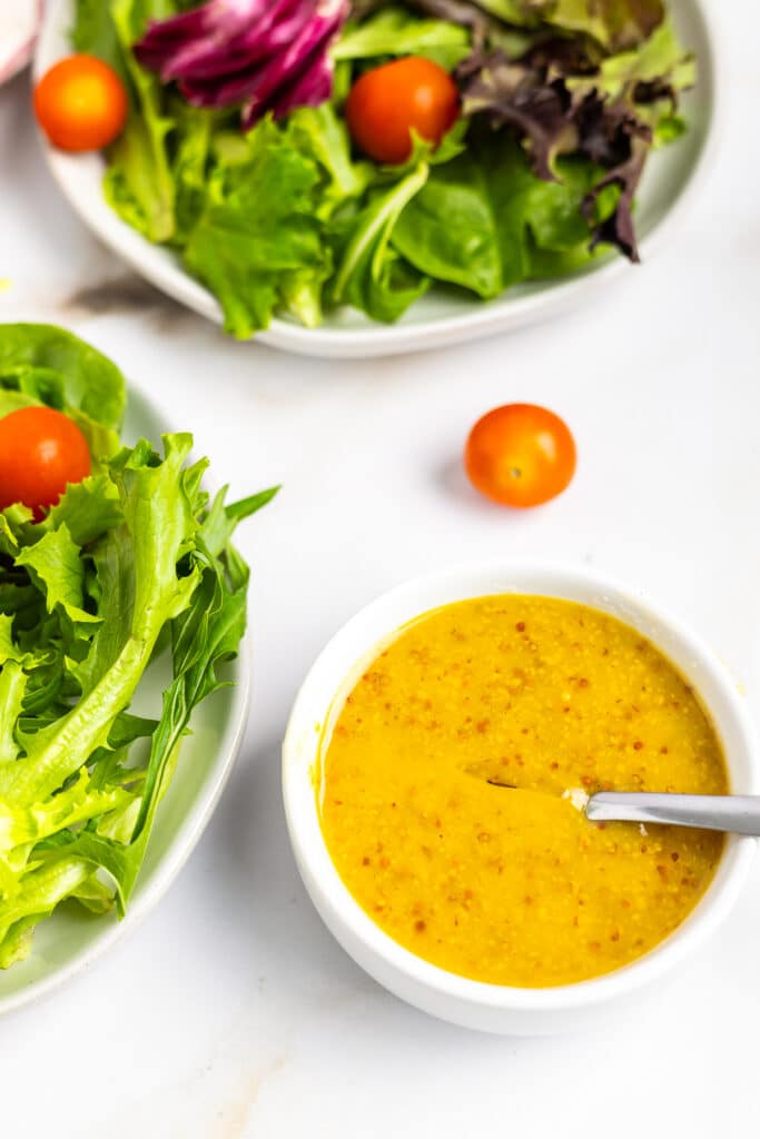 overhead image of Honey Mustard Dressing Recipe in a small white bowl