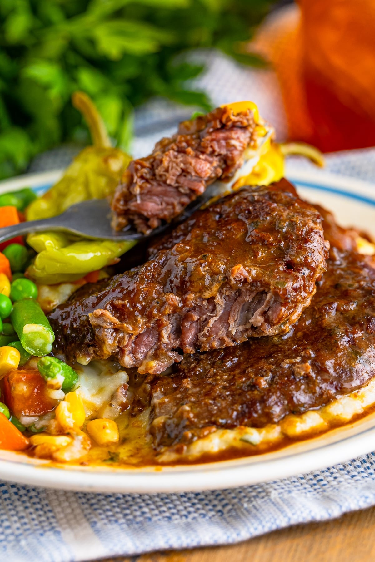 Beef Cubed Steaks on a white plate with a bite taken out
