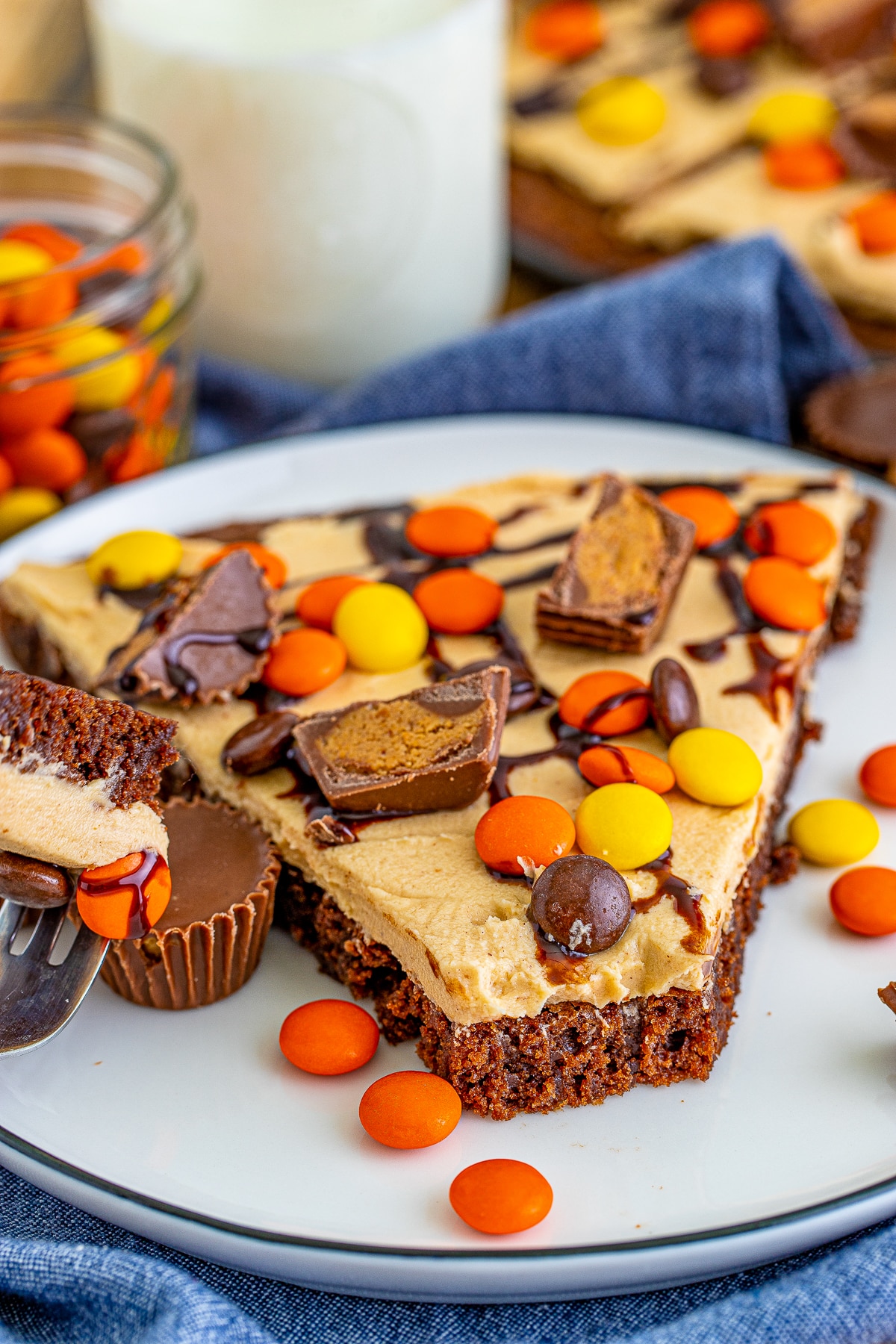 a piece of Dessert Pizza on a white plate with a bite taken out