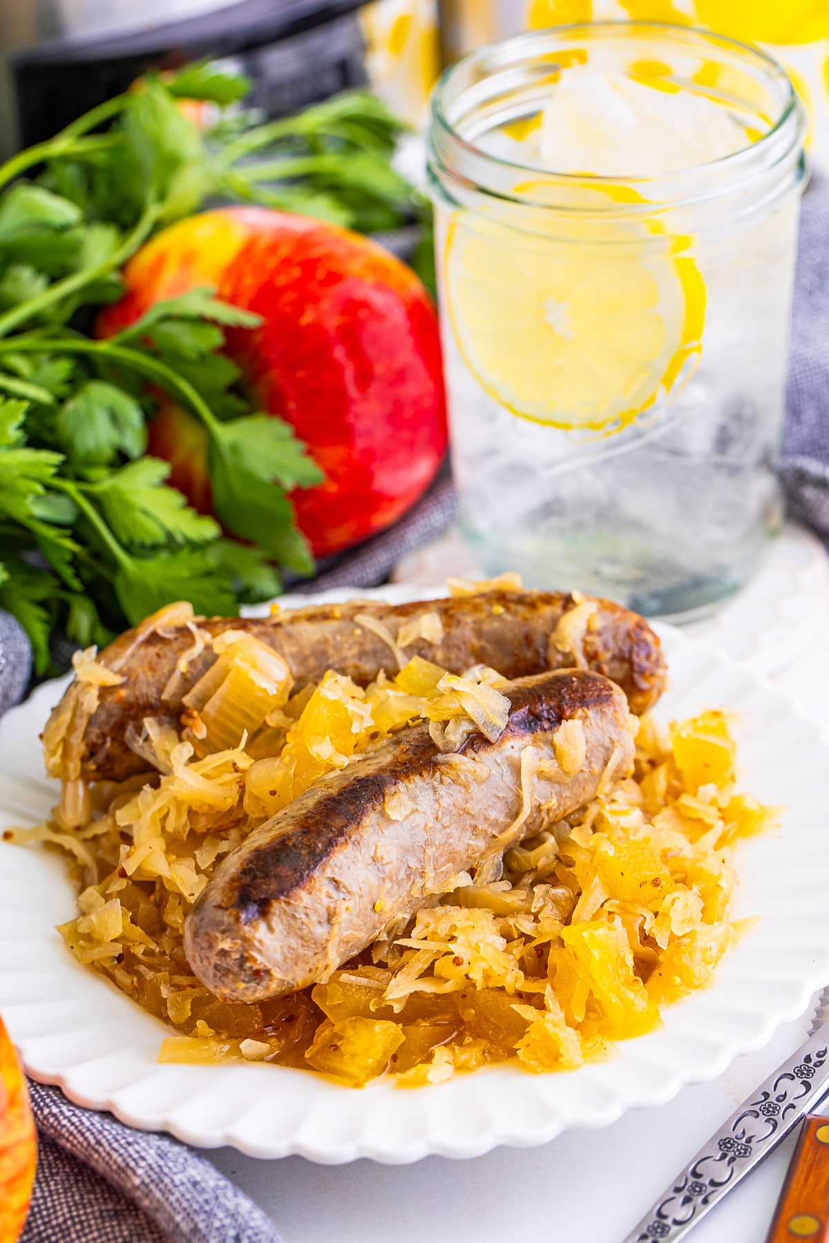 a serving of Brats and Sauerkraut on a plate