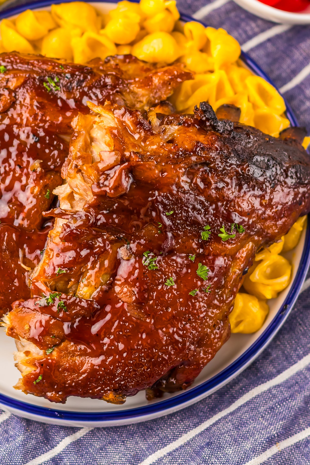 overhead up close image of Slow Cooker Barbecue Ribs with Coke on a white plate