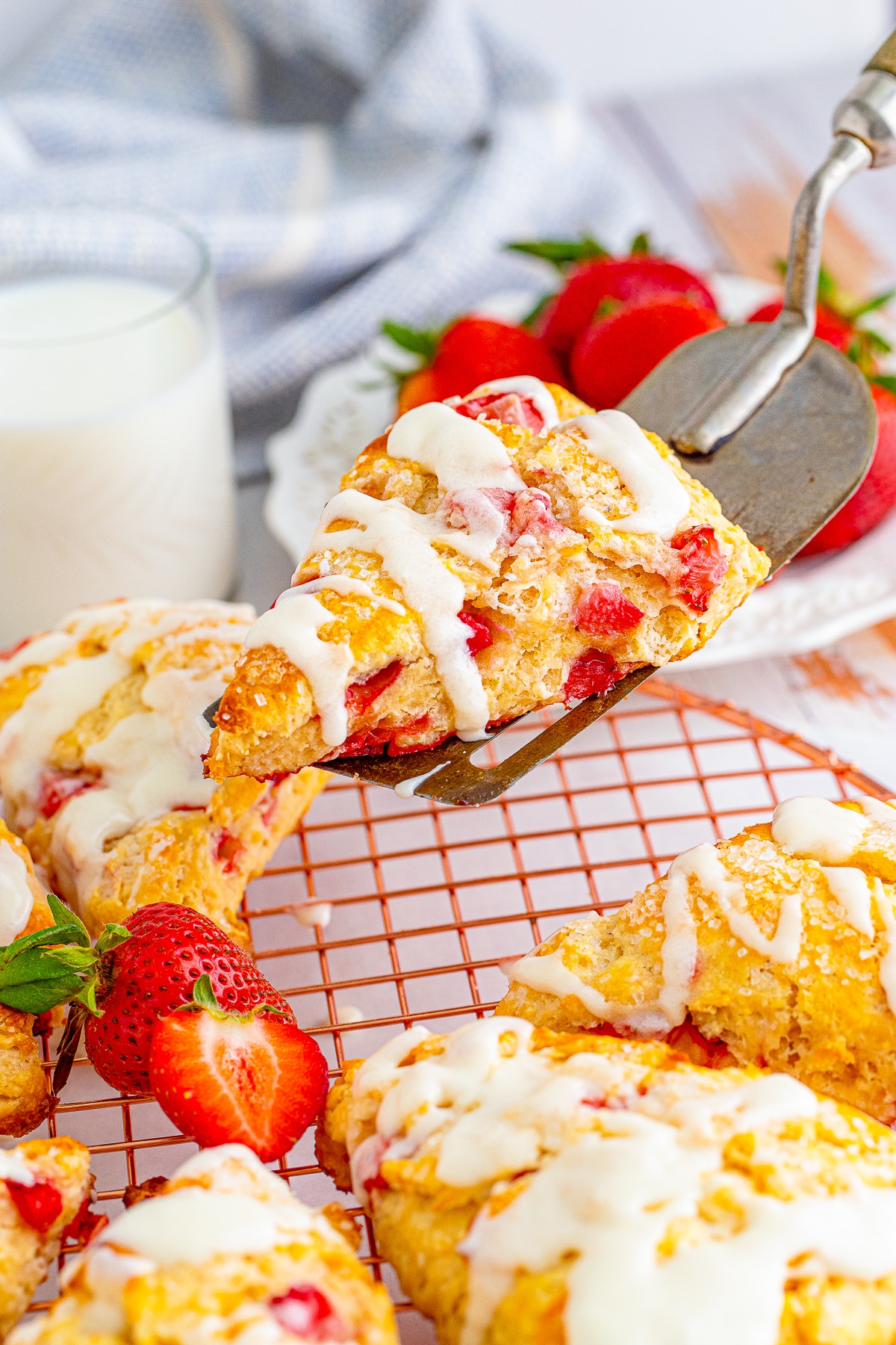 a spatula holding up Strawberry Scones in air 