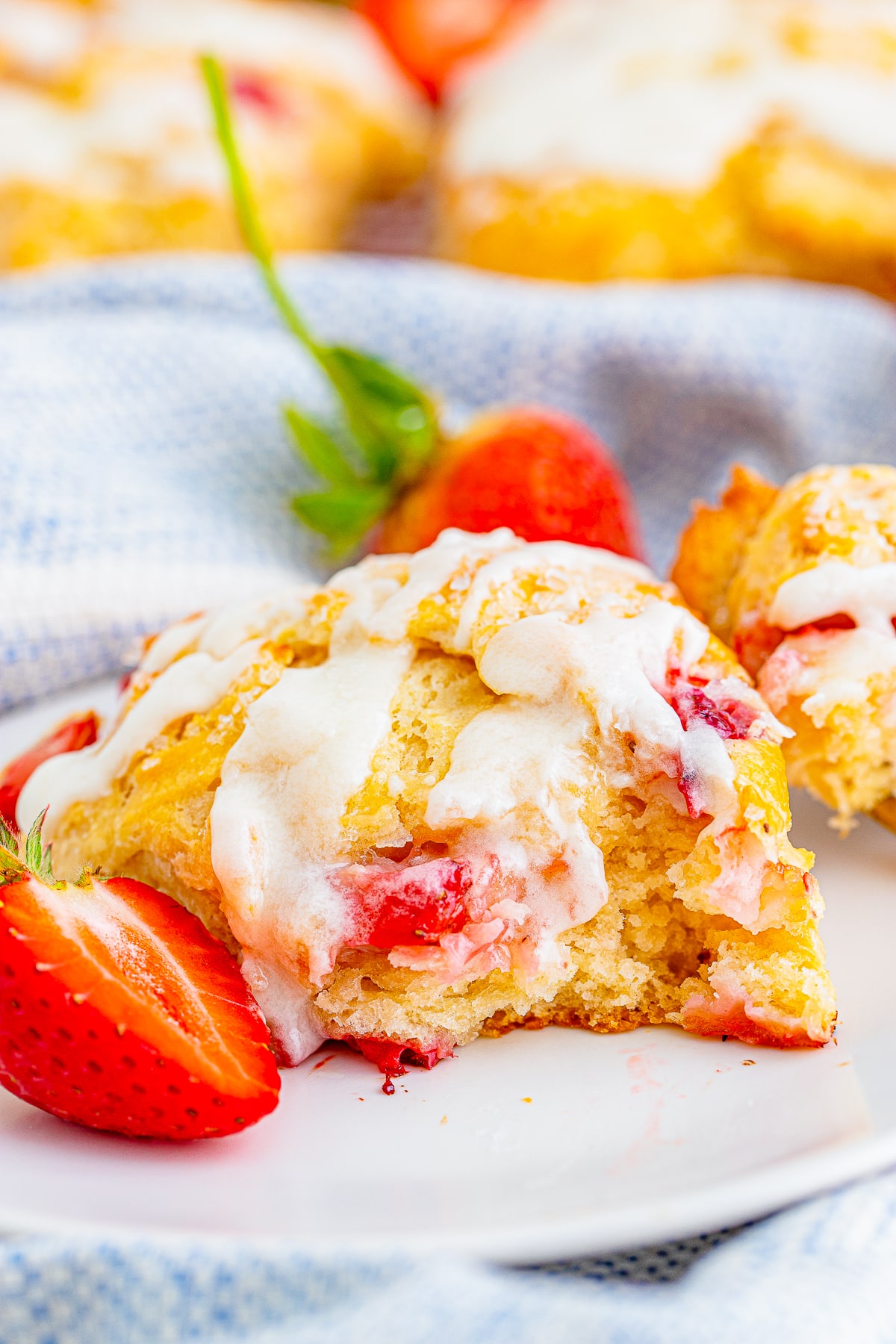 Strawberry Scones on a plate with a bite taken out