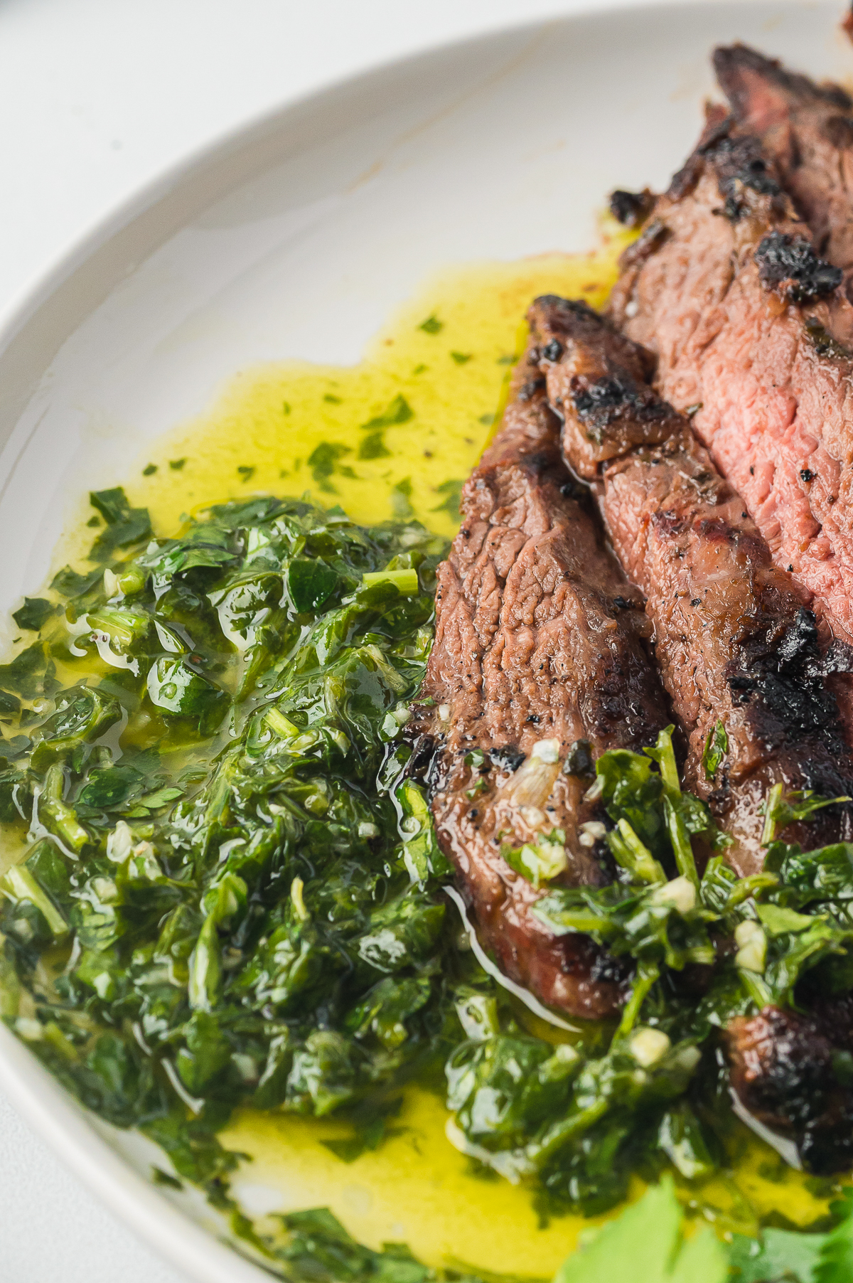 chimichurri sauce on a plate with steak