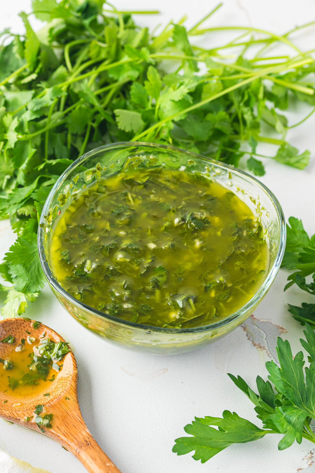 finished chimichurri sauce in a clear bowl