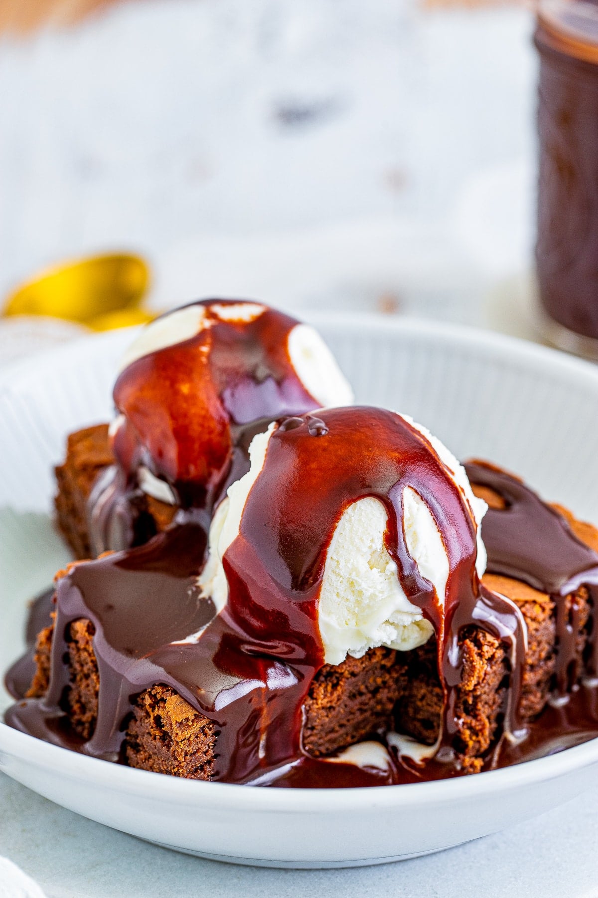 brownies with ice cream topped with hot fudge