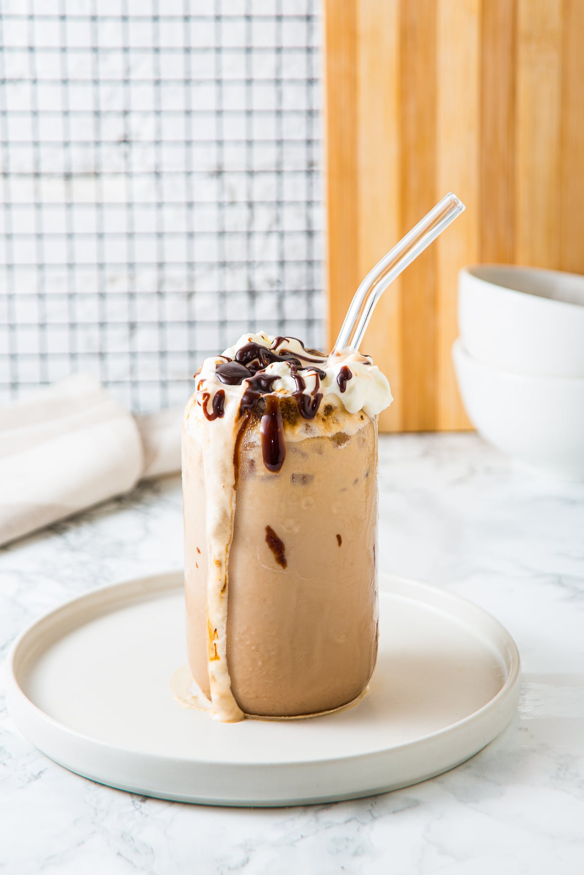 farther away image of iced cafe mocha on a plate