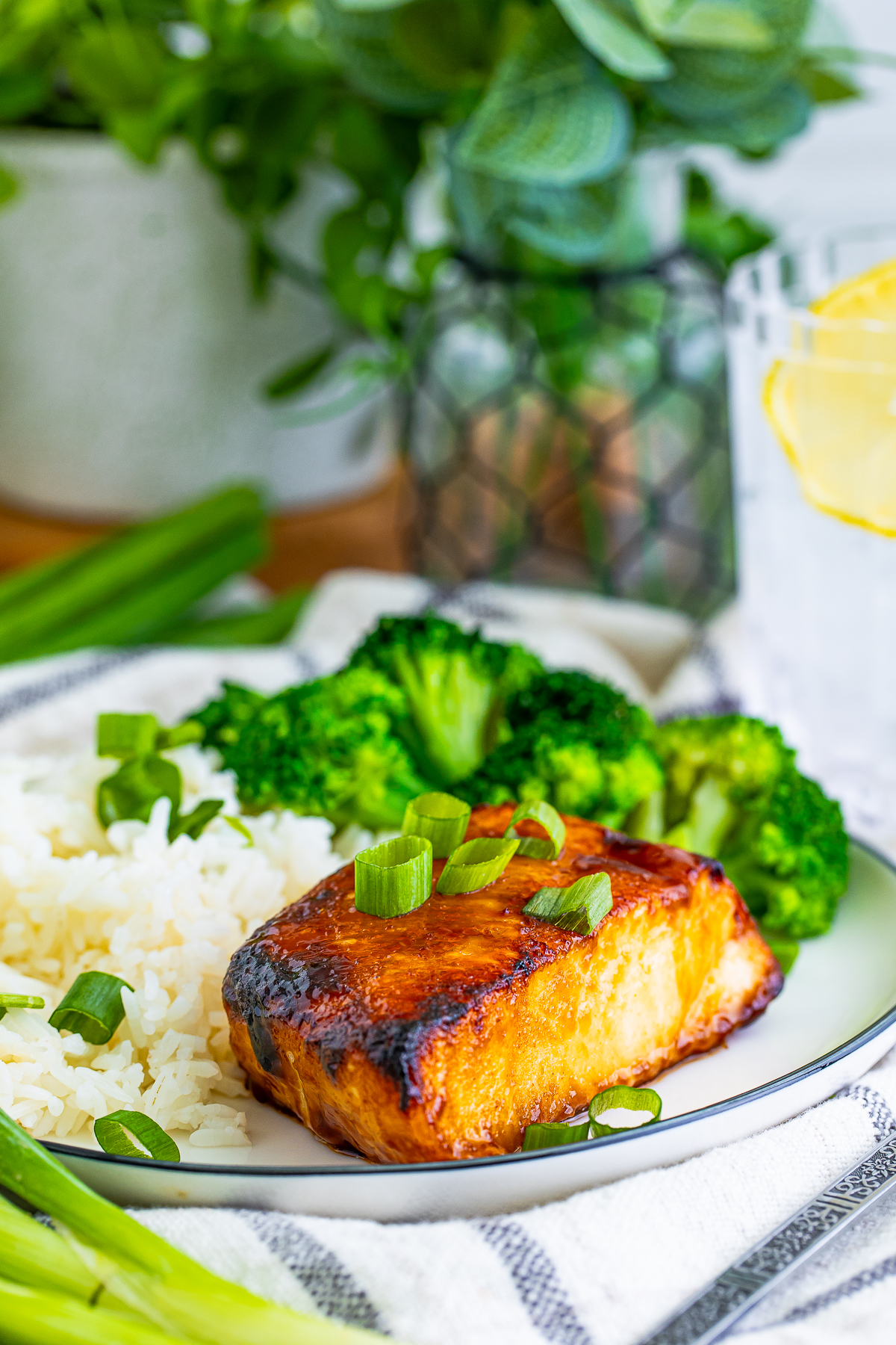 a piece of finished Chilean Sea Bass Recipe on a plate with sides
