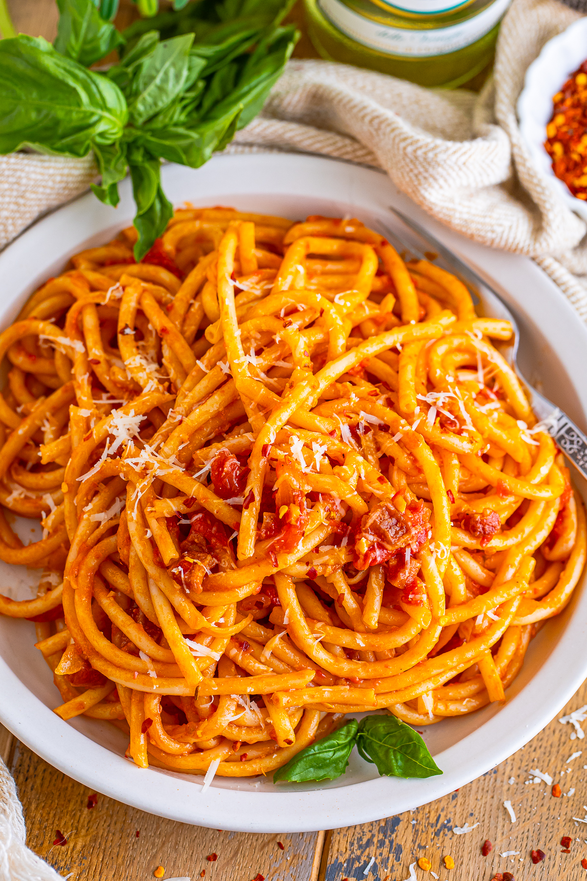 overhead image of Bucatini all Amatriciana on a white plate