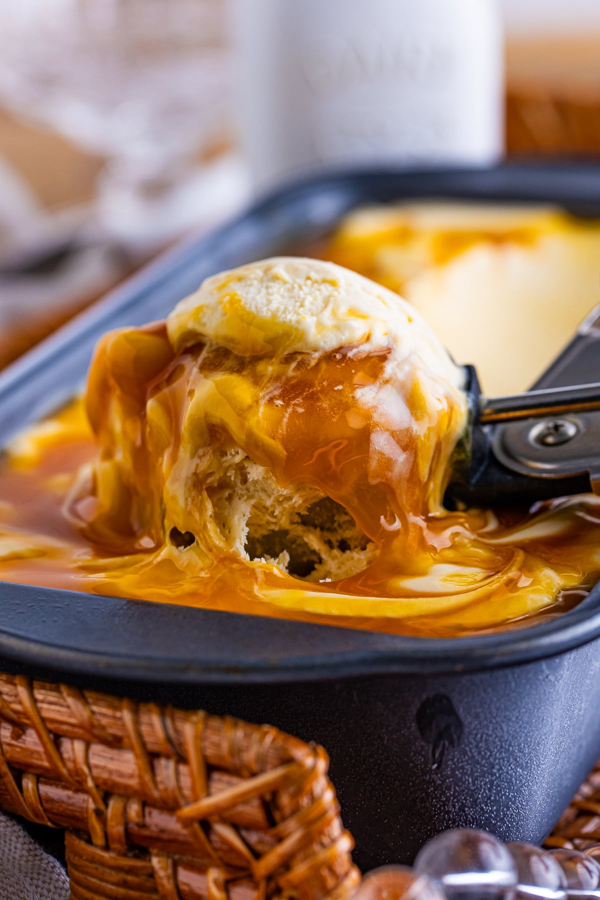 an ice cream scoop scooping out some Butterscotch Ice Cream