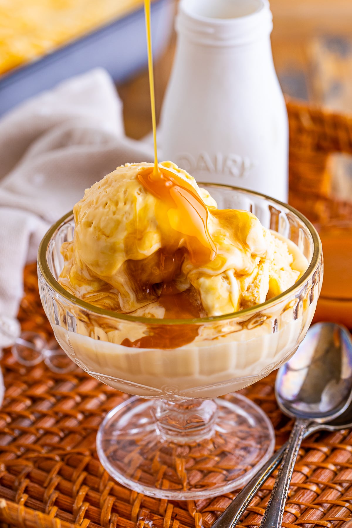 syrup being poured on top of Butterscotch Ice Cream