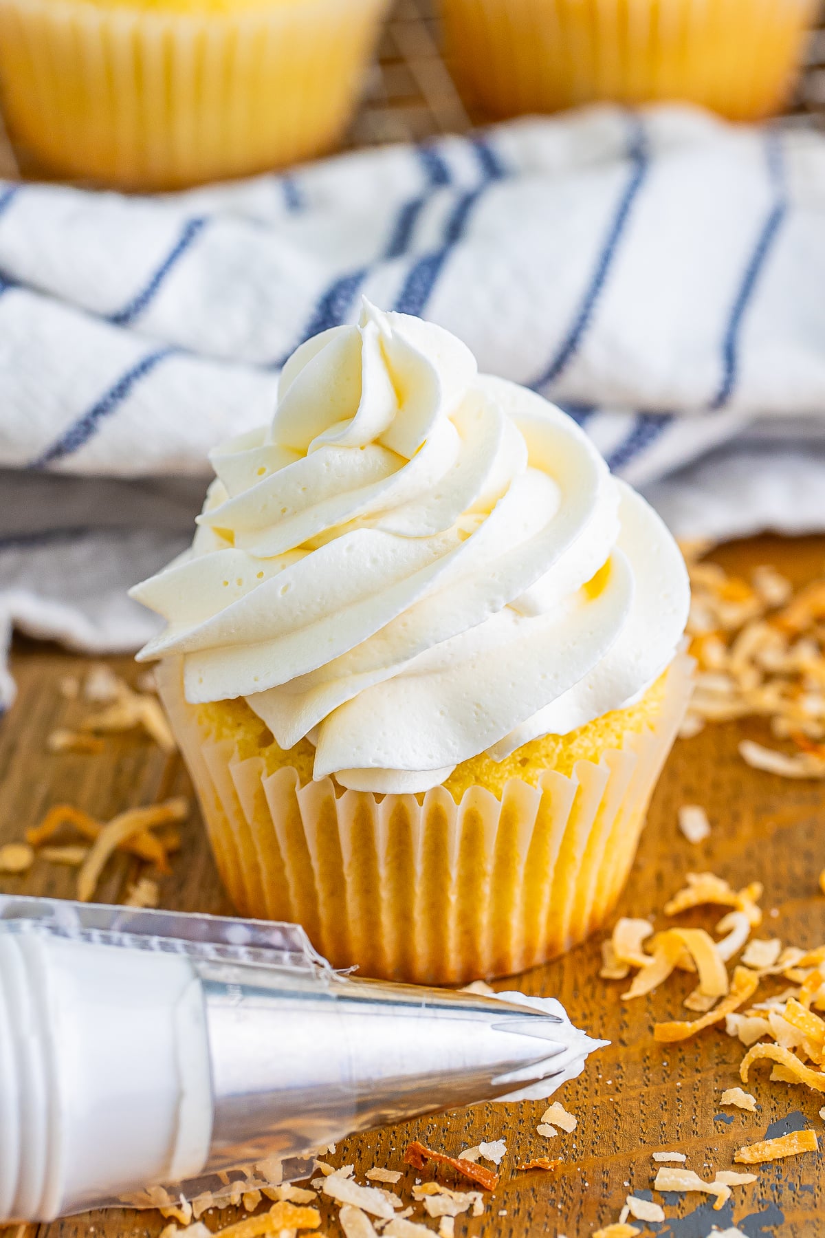 a cupcake topped with Coconut Frosting