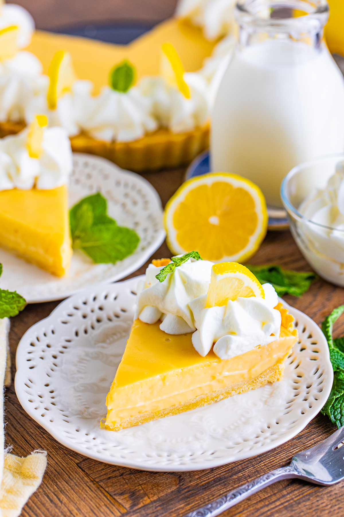 a slice of Lemonade Tart on white plate