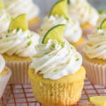 Margarita Cupcakes topped with swirled tequila buttercream, lime zest, and a fresh lime wedge.