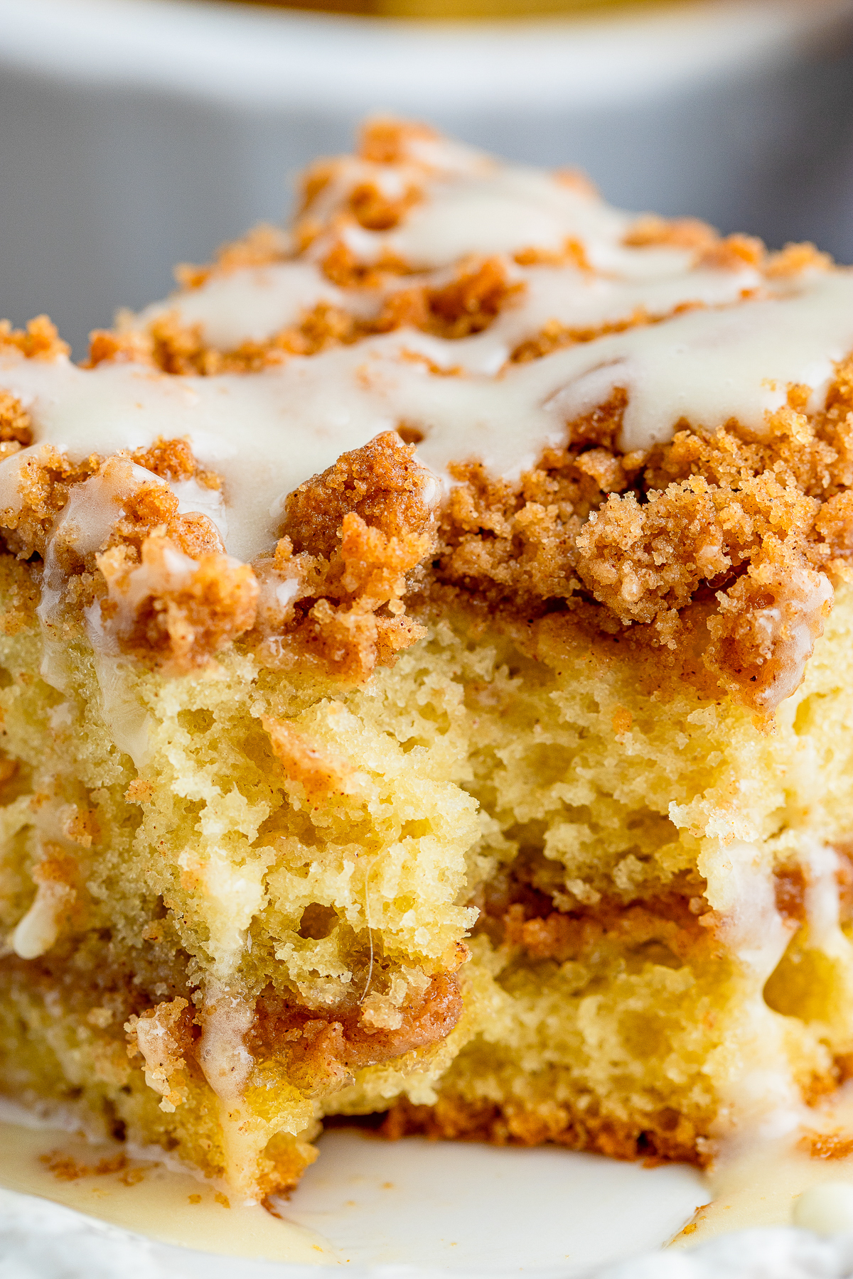 up close image of Sour Cream Coffee Cake with a bite taken out