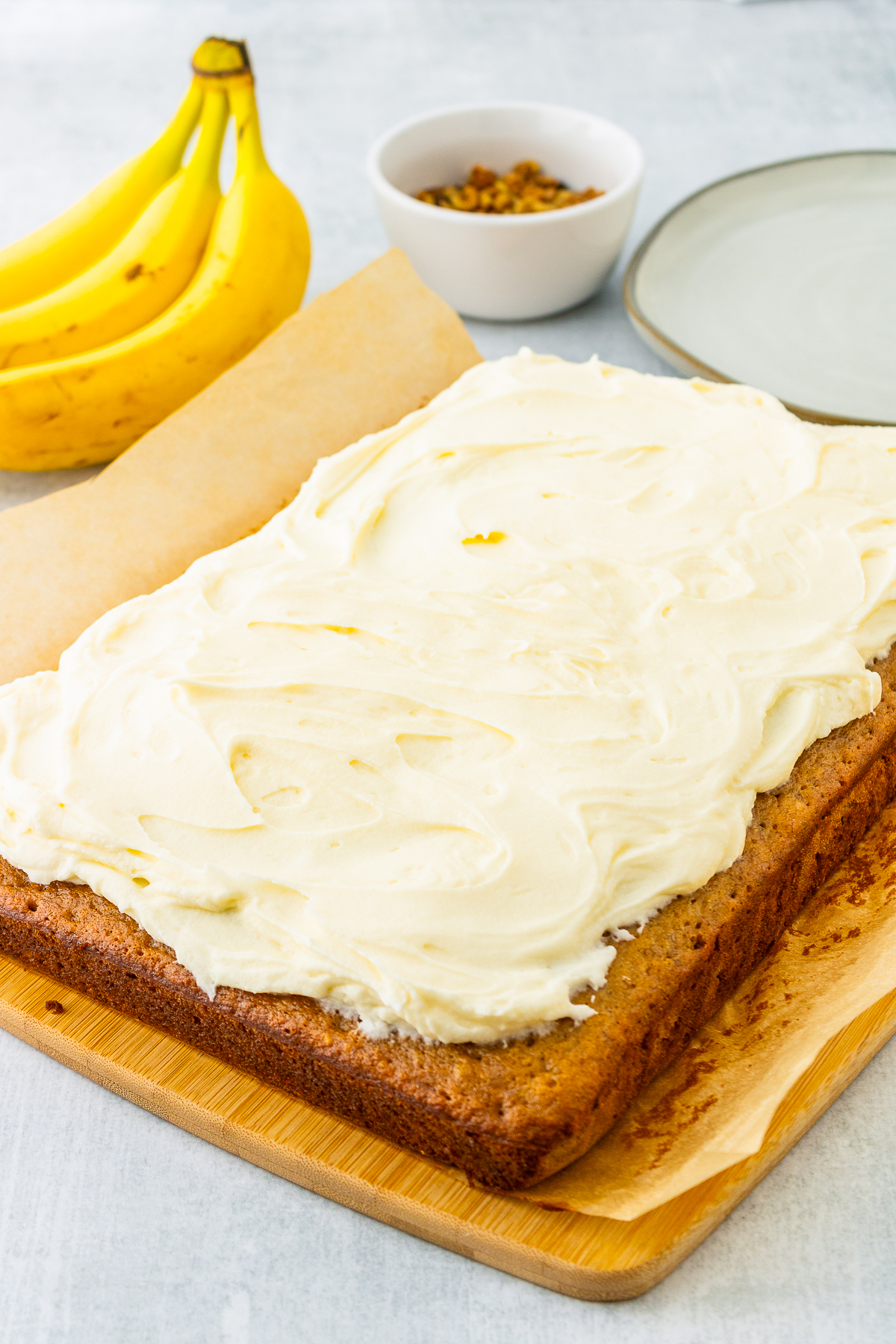 Banana Bars frosted on a cutting board