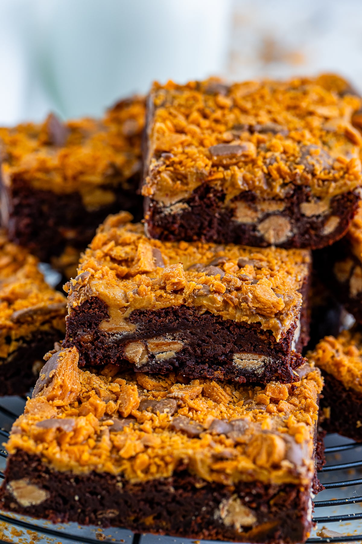 stacked Butterfinger Brownies on a wire rack