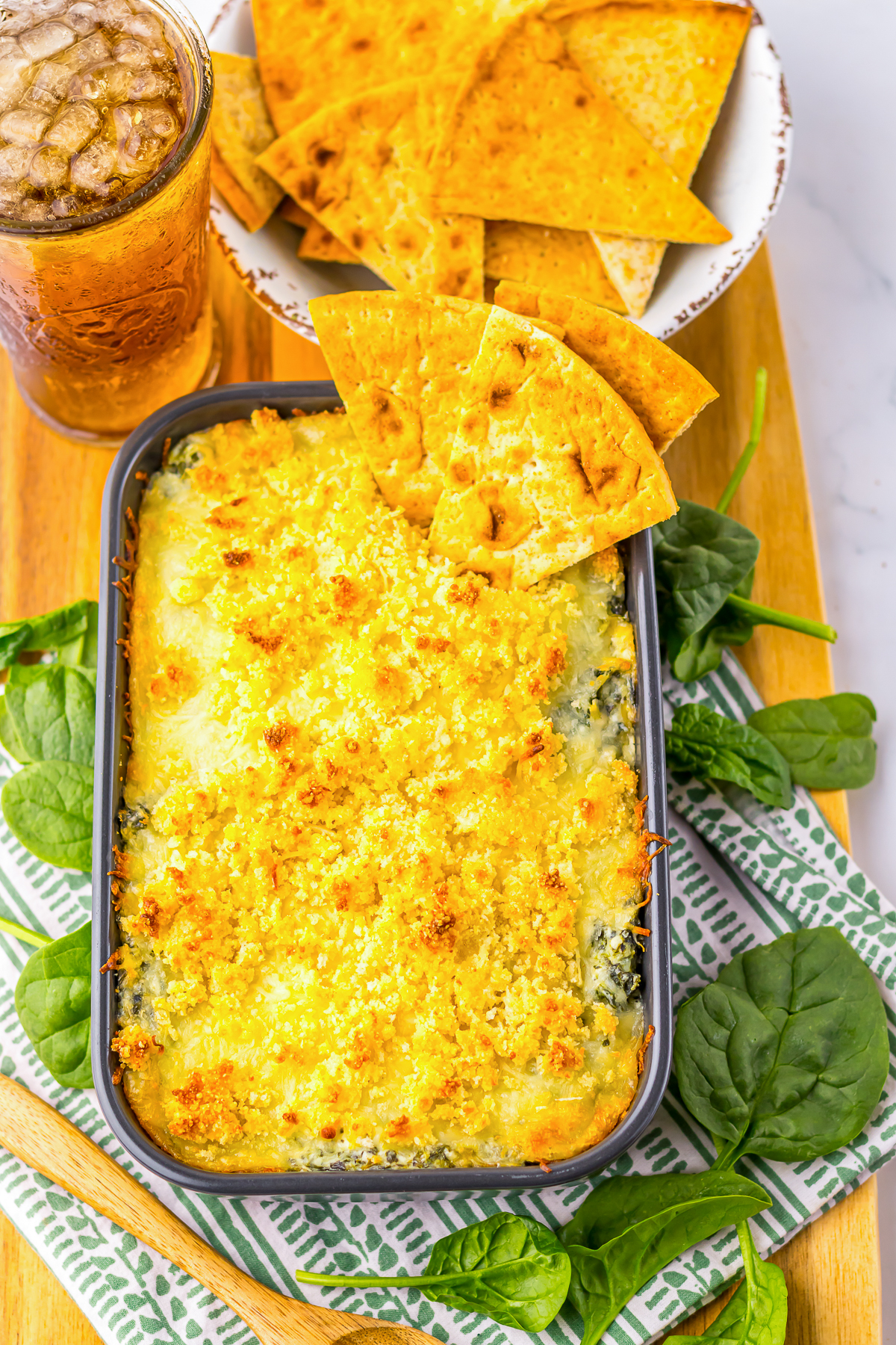 overhead image of hot spinach dip in baking dish