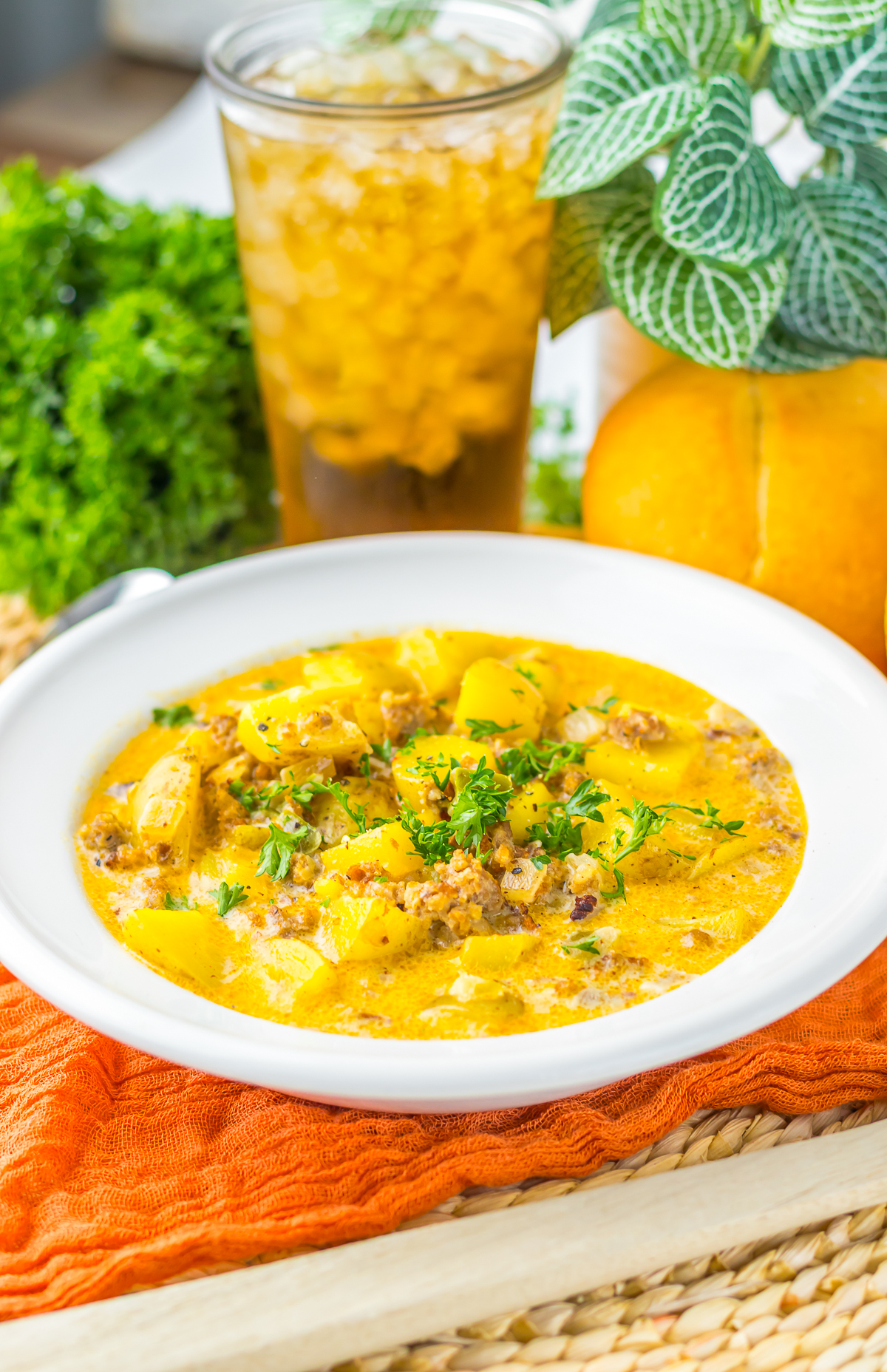 Potato & Sausage Soup served in a white bowl
