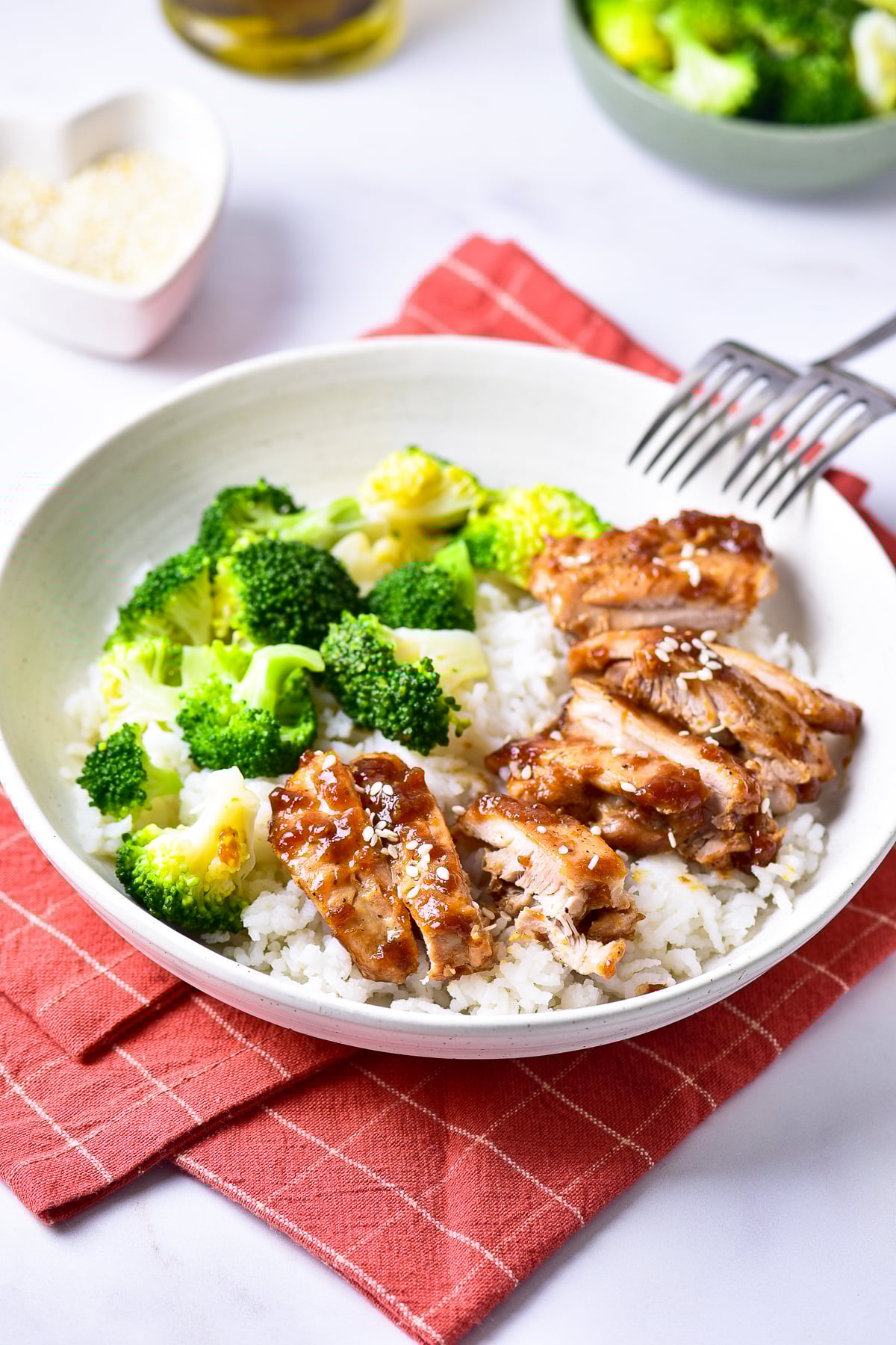 finished Teriyaki Chicken Recipe served in white bowl with sides
