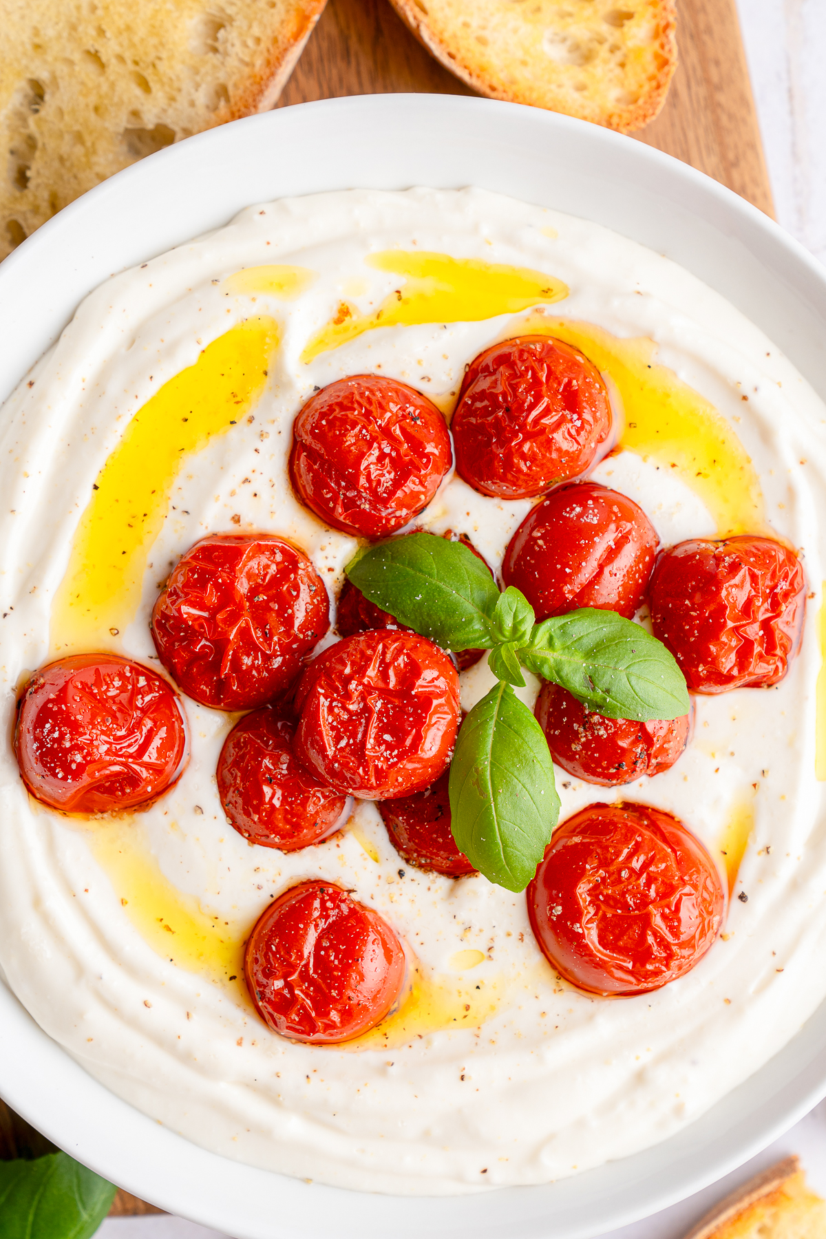up close overhead image of Whipped Ricotta Cheese in a white bowl
