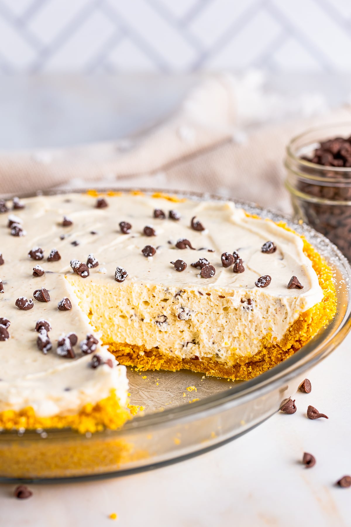 Cannoli Pie in baking dish with slices taken out