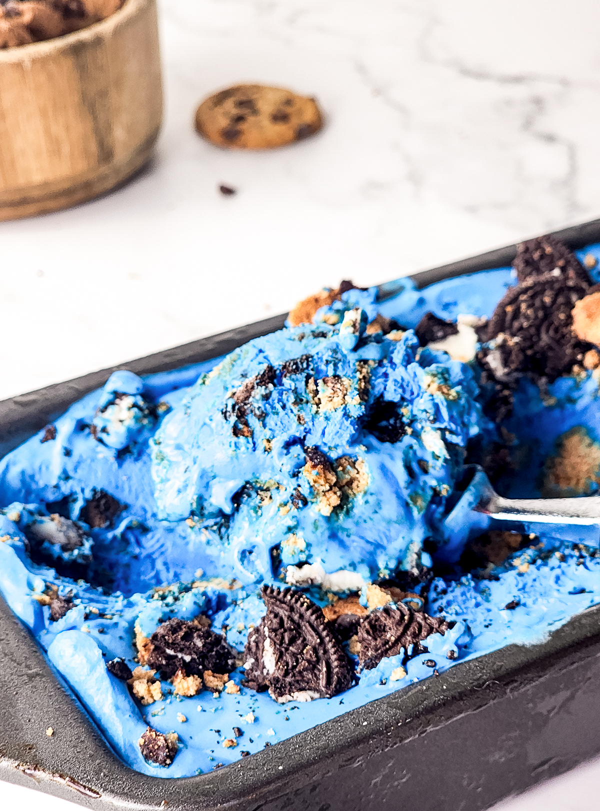 scooping out Cookie Monster Ice Cream  from the pan