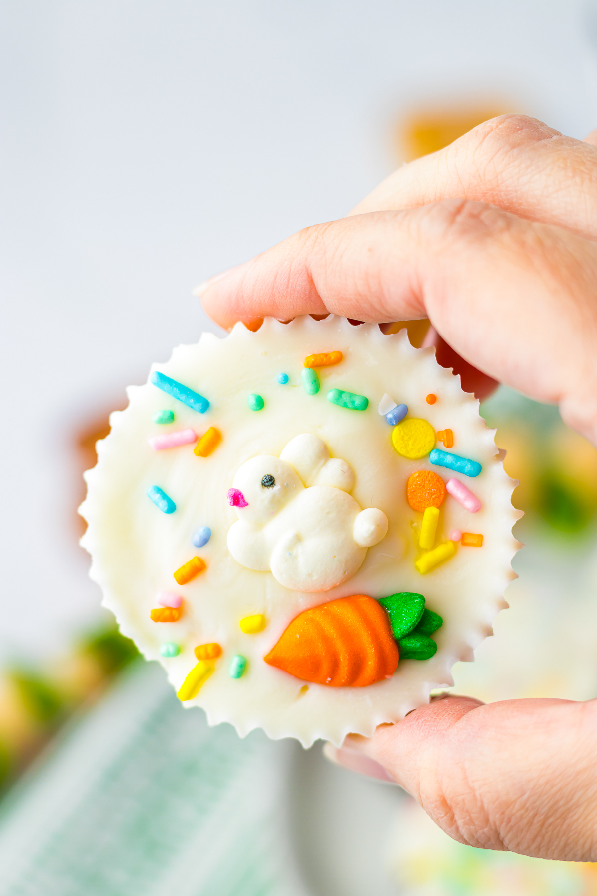 a hand holding up Coconut Candy in air