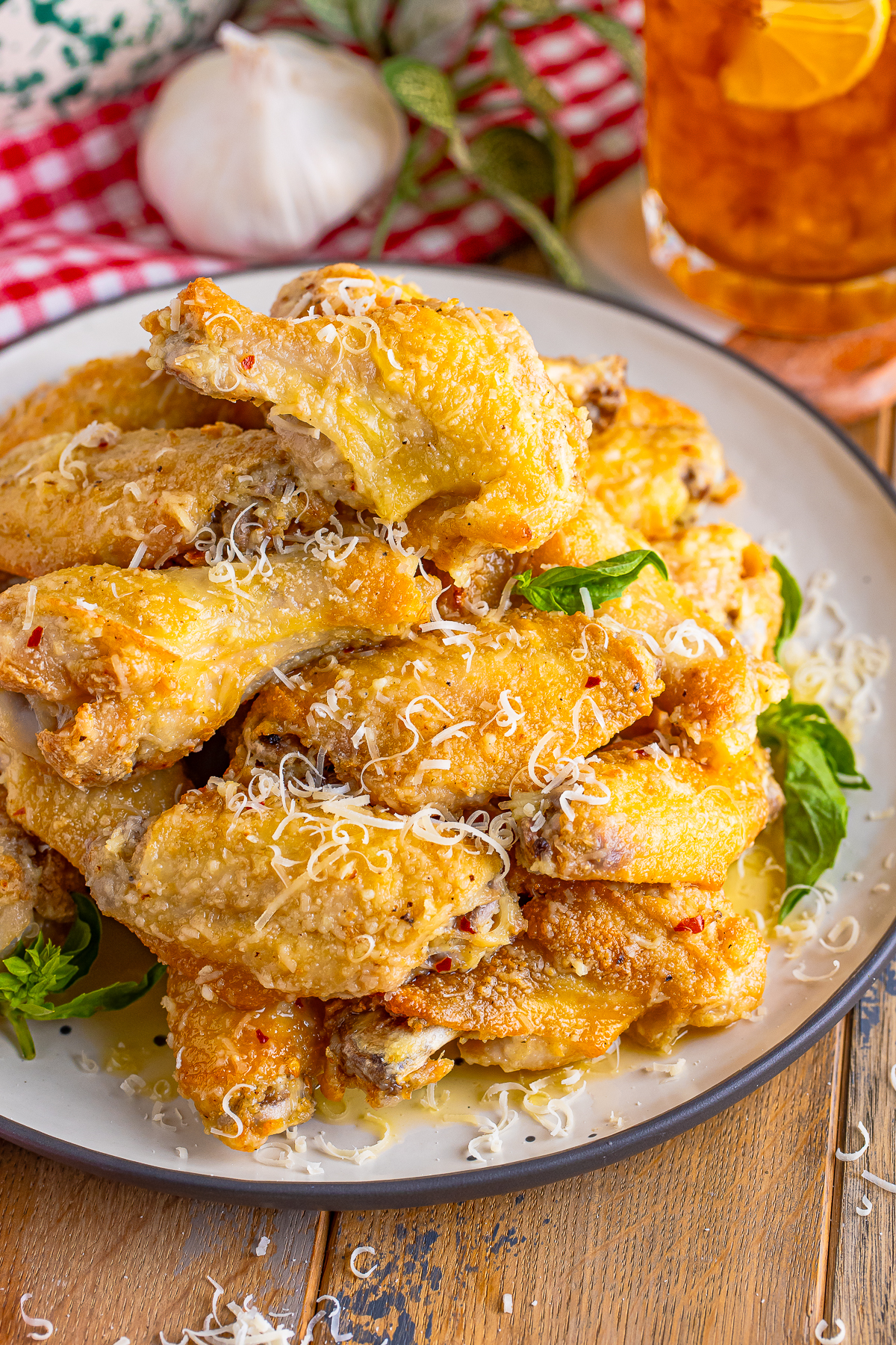 finished Garlic Parmesan Hot Wings on a tan plate