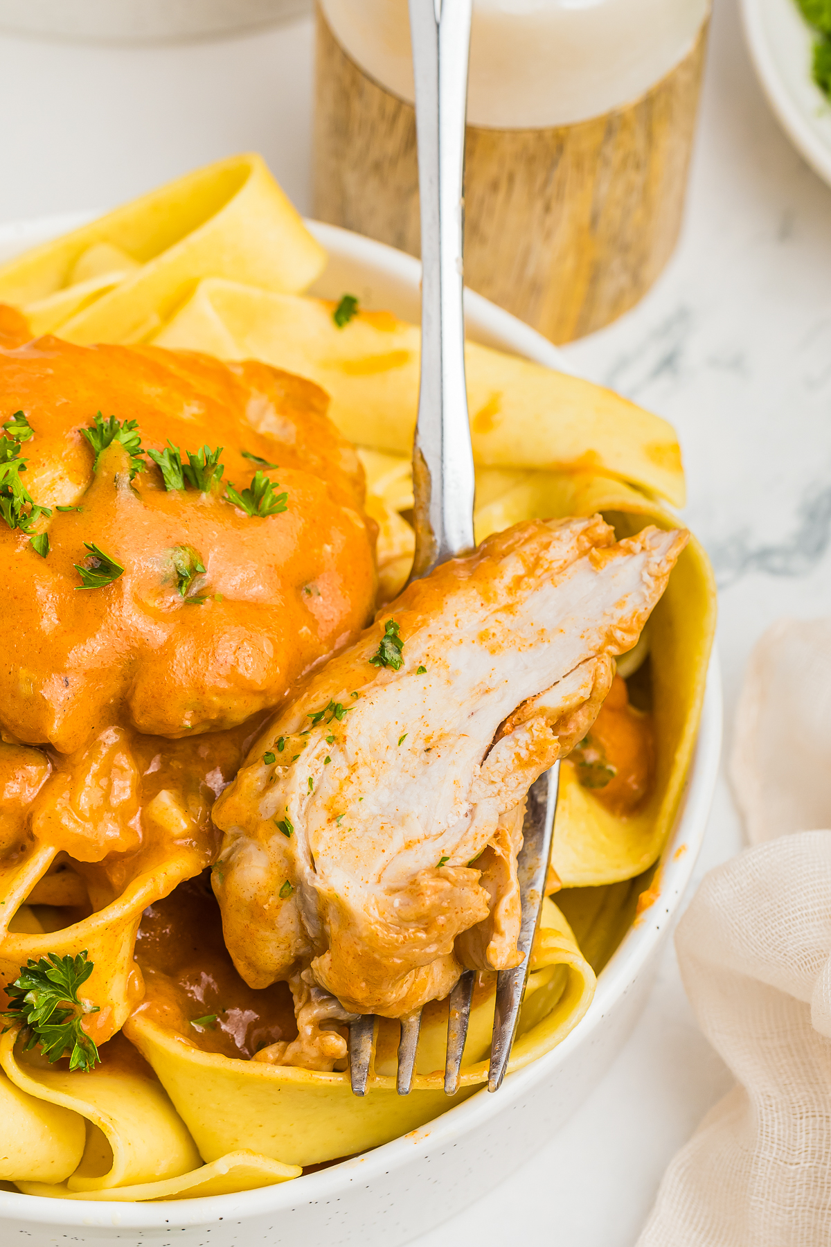 a fork grabbing a bite of Paprika Chicken