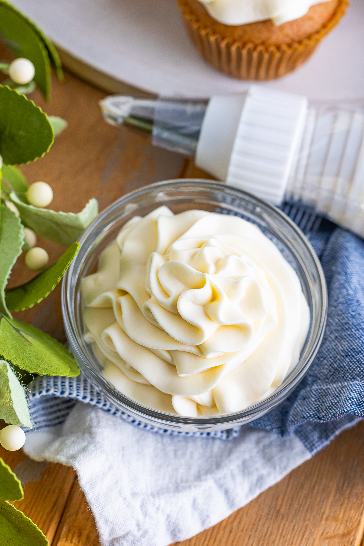 Whipped Cream Cream Cheese Frosting in a small glass bowl