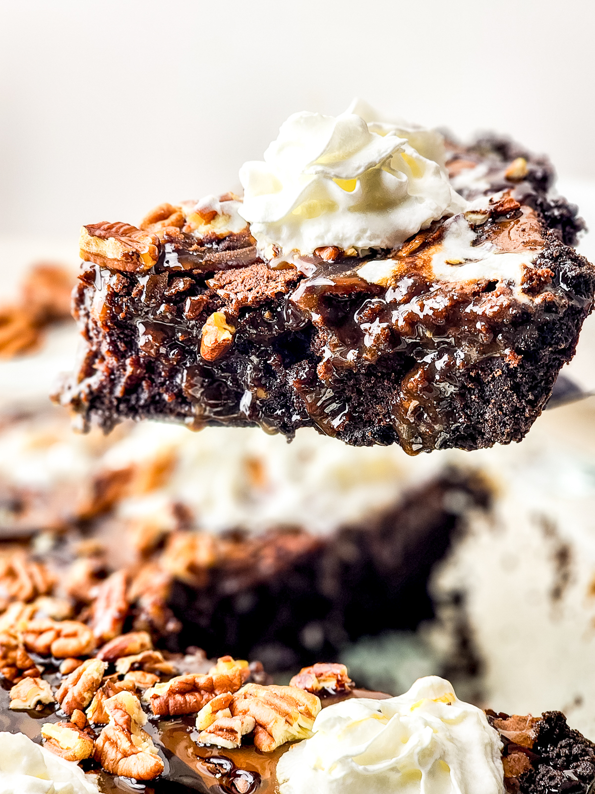 a slice of Brownie Pie on a cake server in air