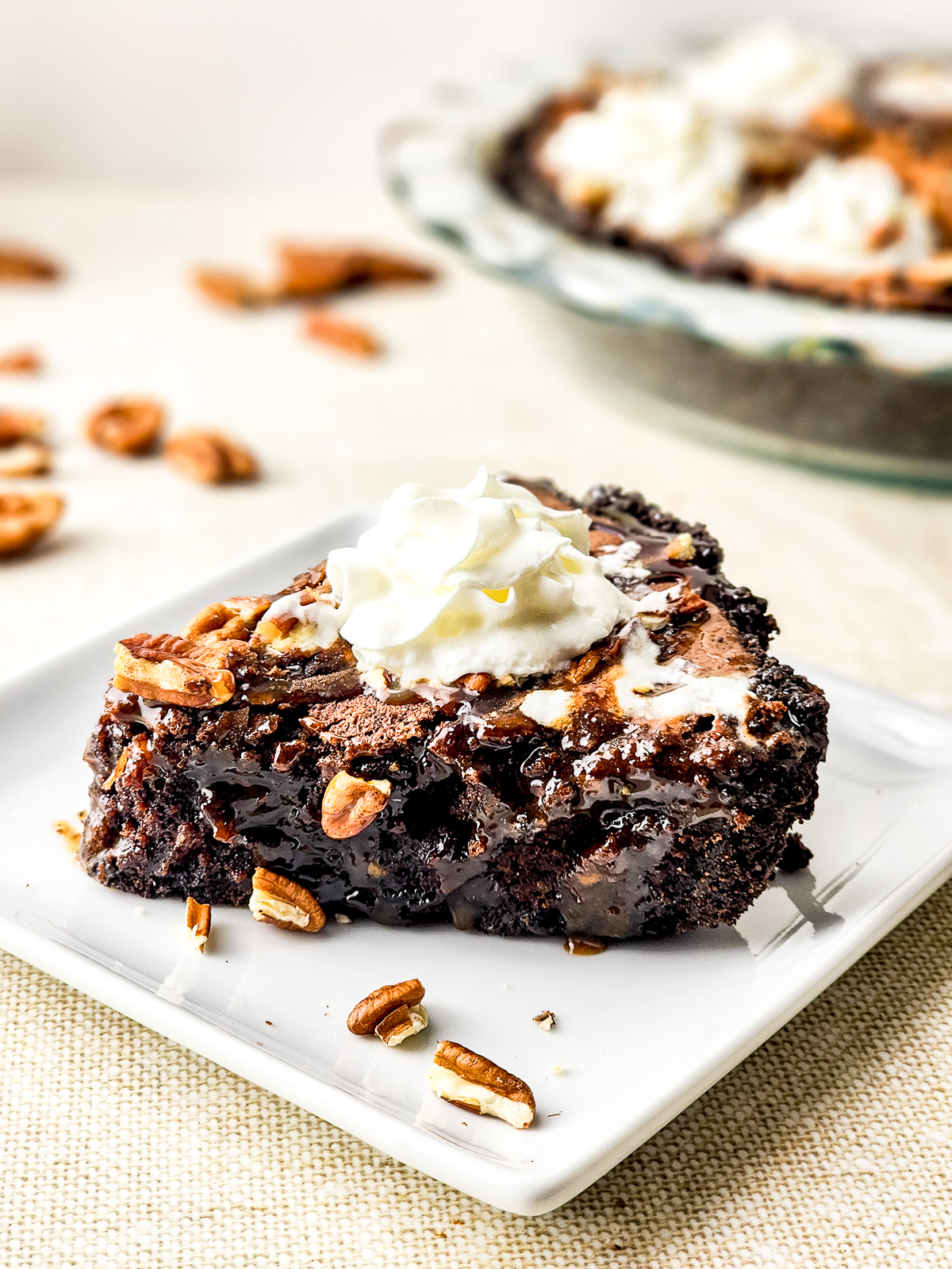 a slice of Brownie Pie on a white plate