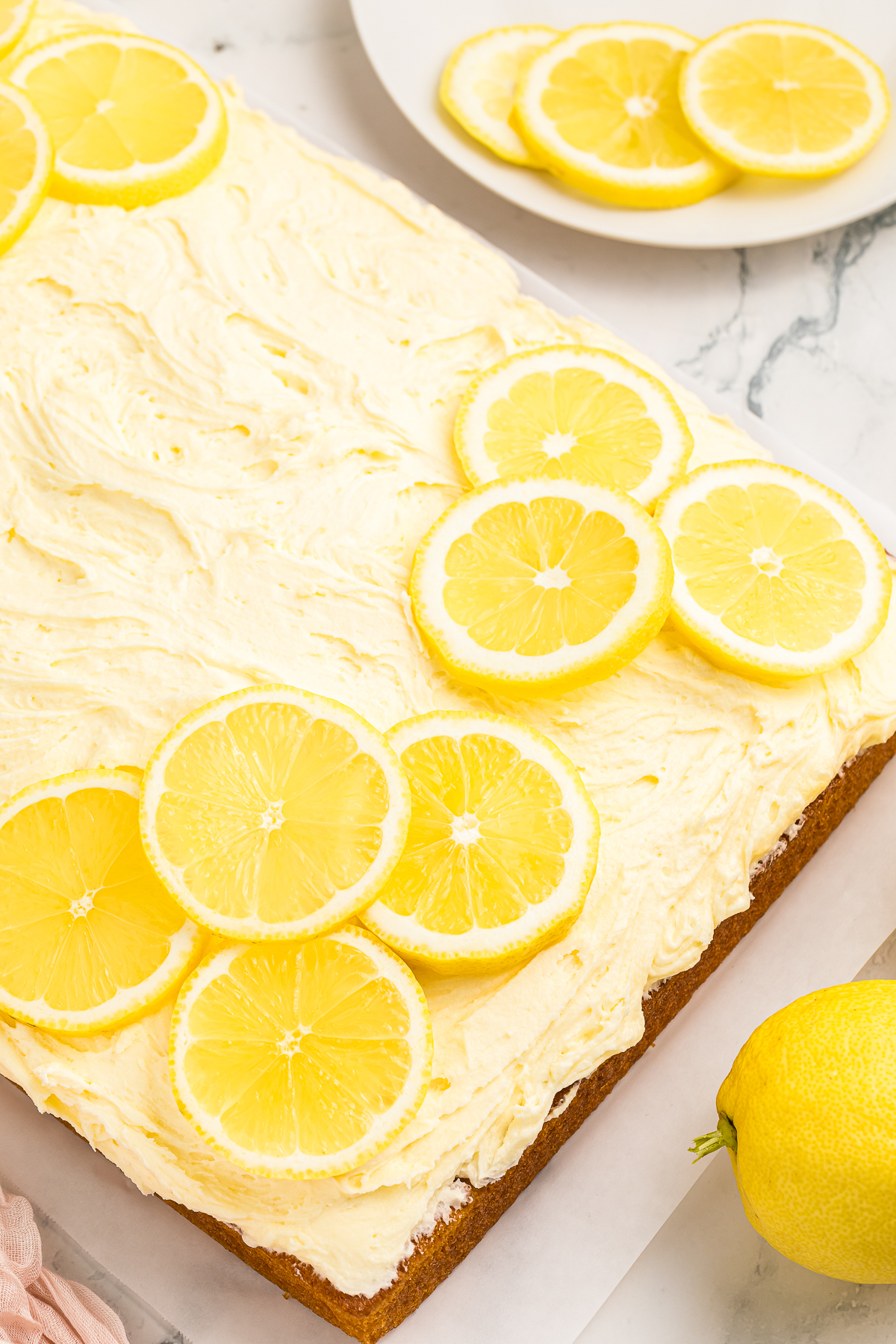 overhead up close image of frosted Lemon Cake