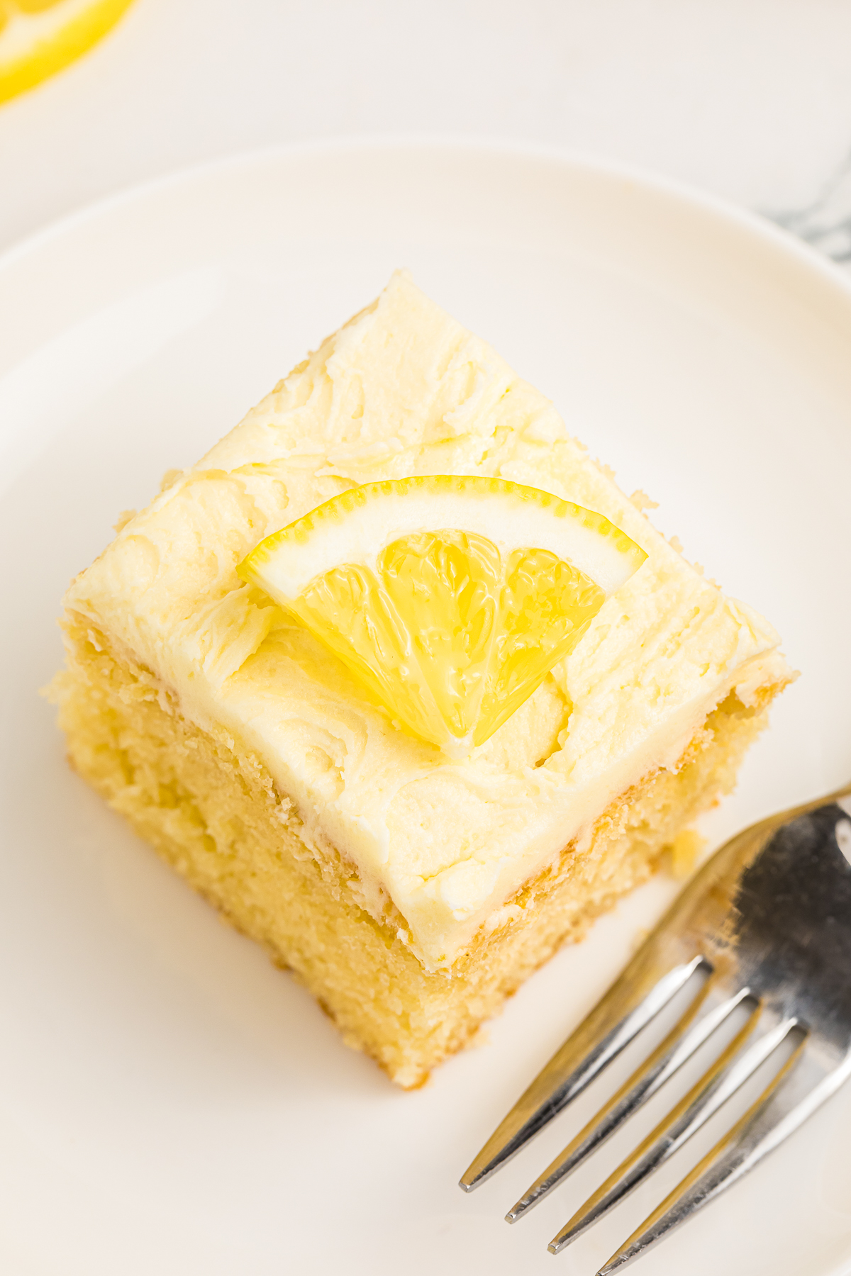 a slice of Lemon Cake on white plate