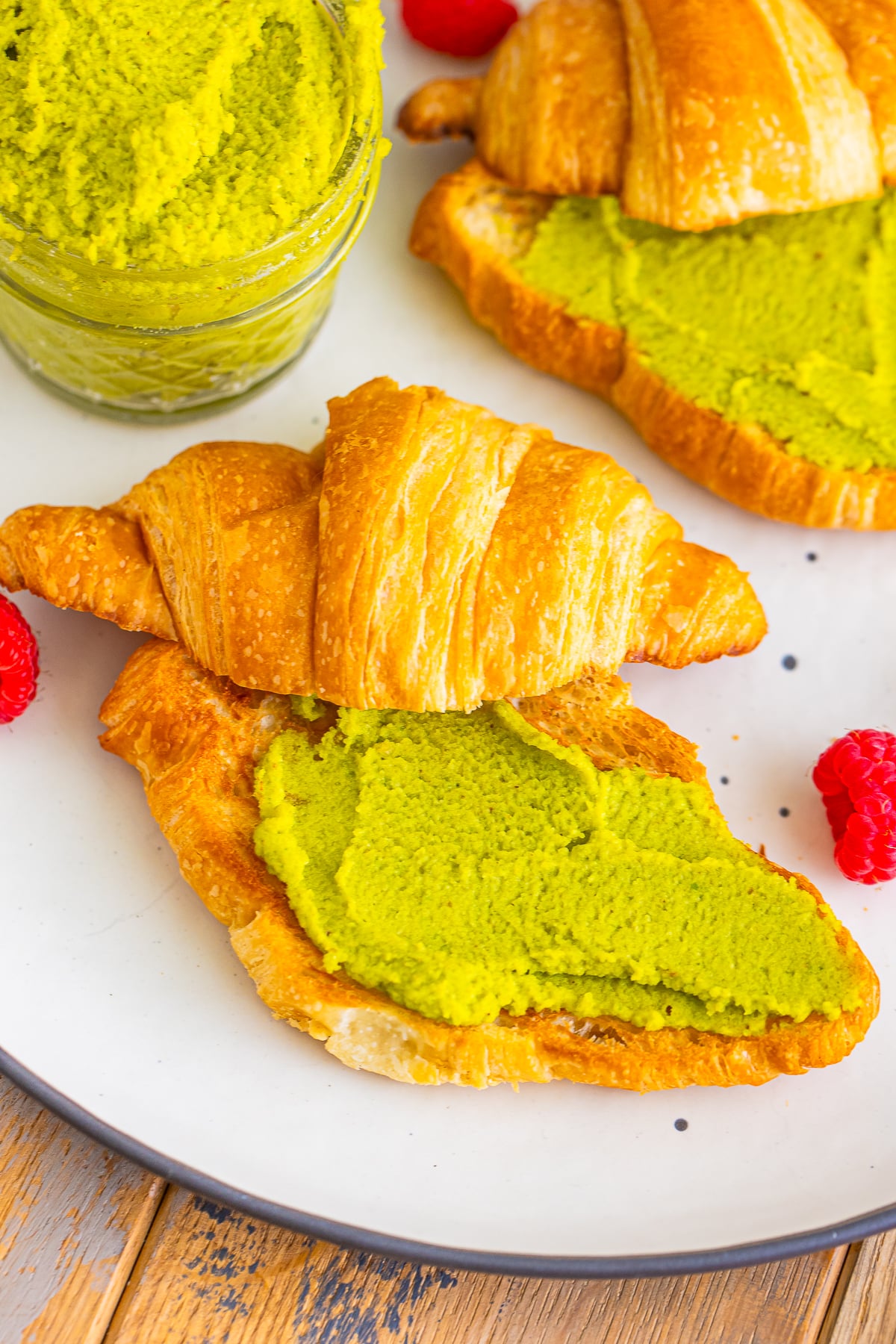 overhead image of Pistachio Spread smeared on a croissant