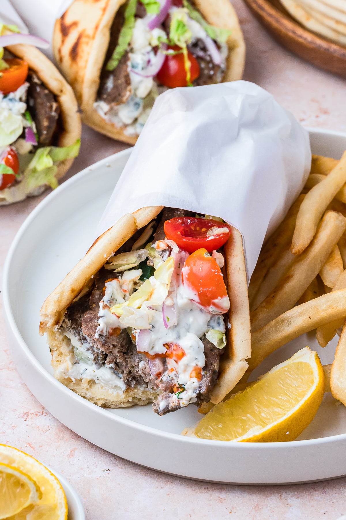 Gyros on a plate with a bite taken out