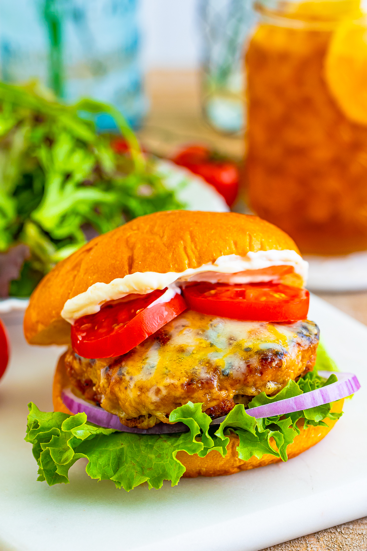 turkey burger recipe on a white serving board