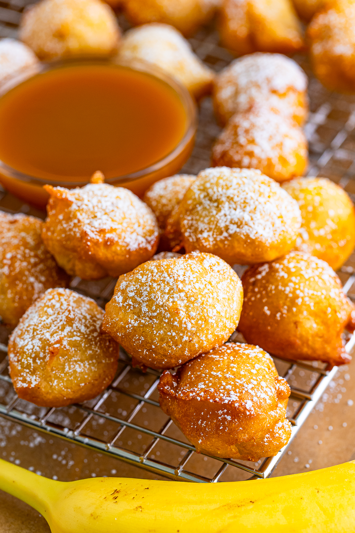 stacked Banana Fritters on a wire rack