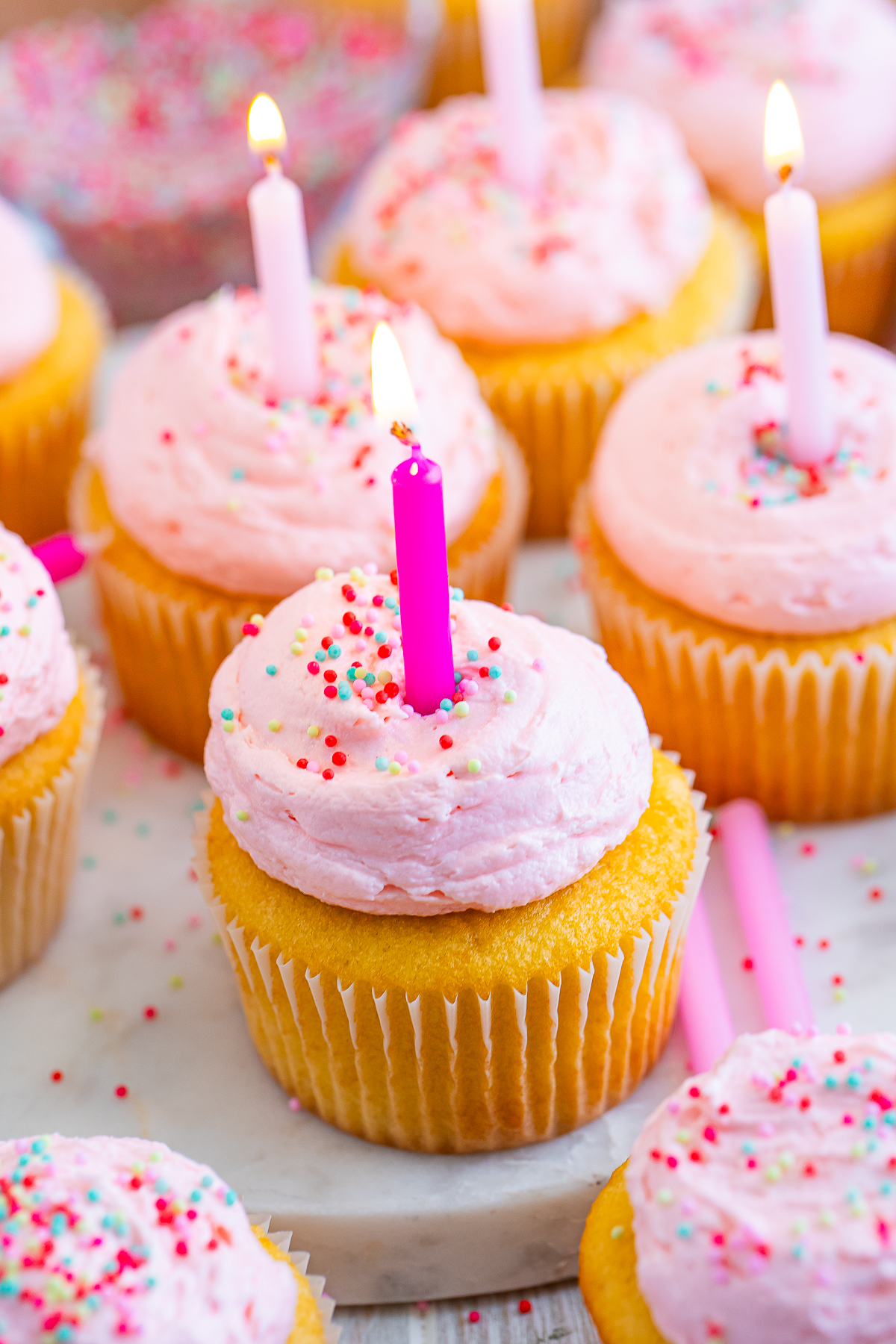 up close image of Birthday Cupcakes with a birthday candle